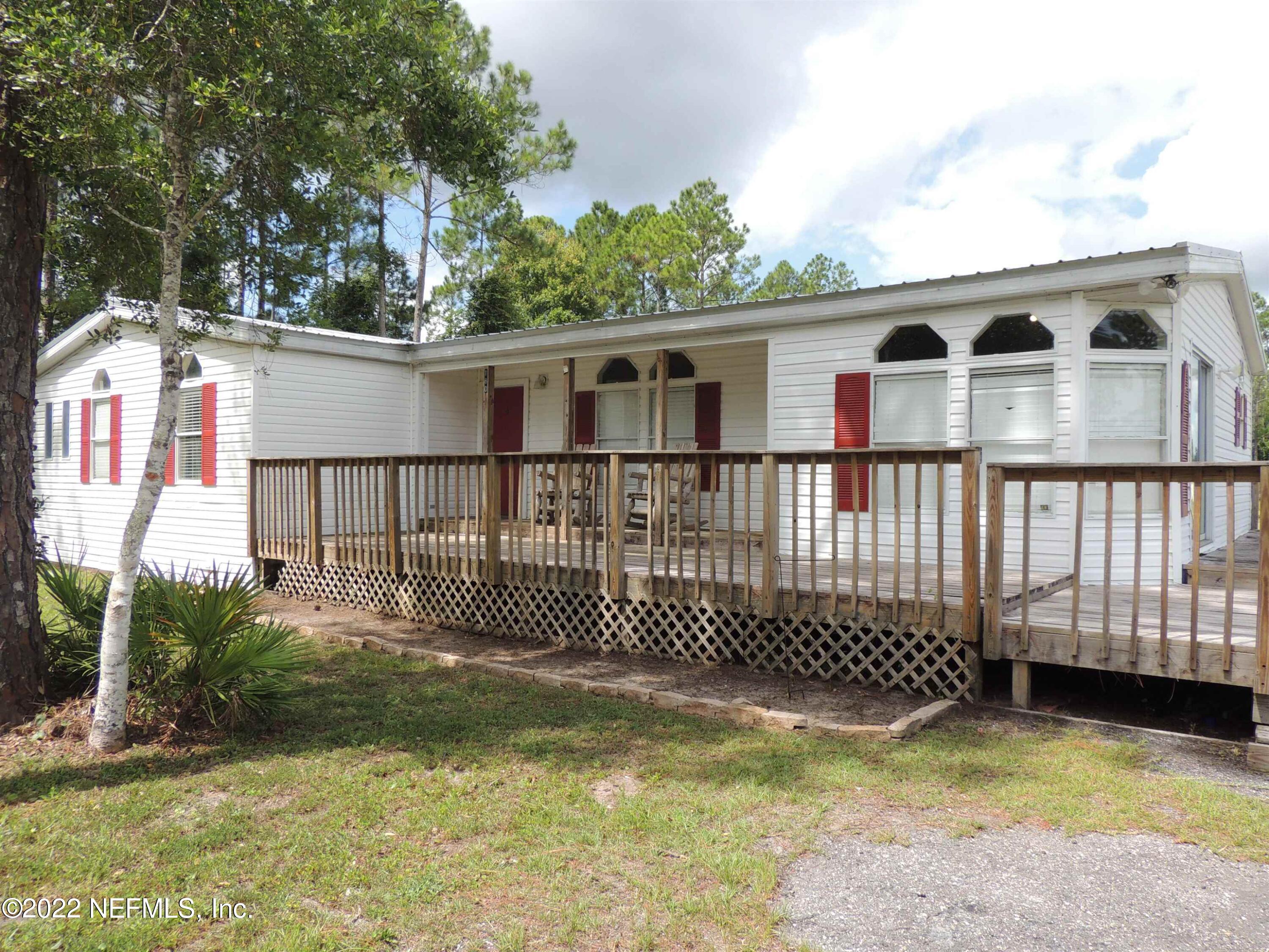 1801 Forbes Road St. Augustine, FL 32092 - Photo 1 of 28 a front view of a house with a garden