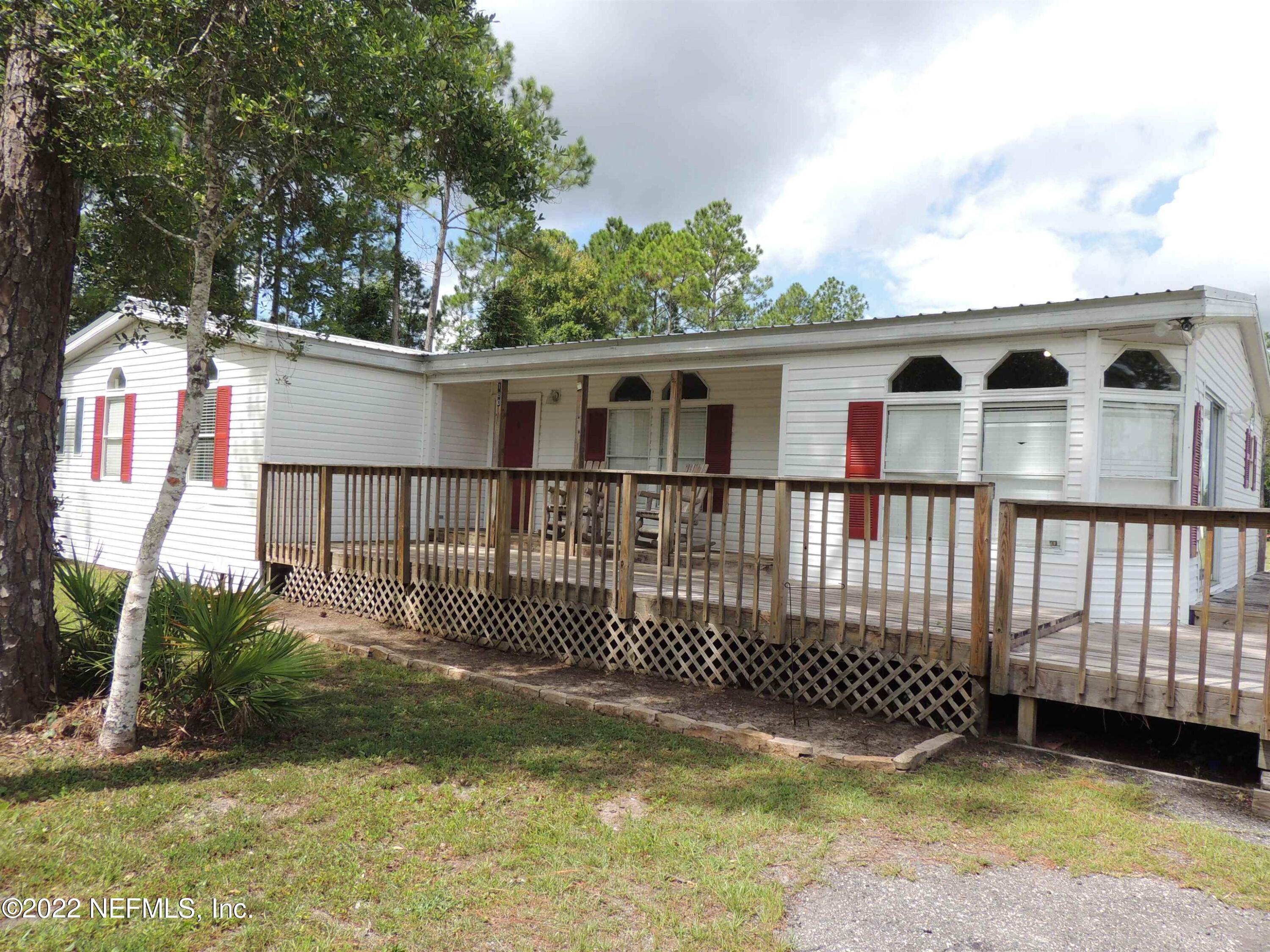 1801 Forbes Road St. Augustine, FL 32092 - Photo 16 of 28 a front view of a house with a garden