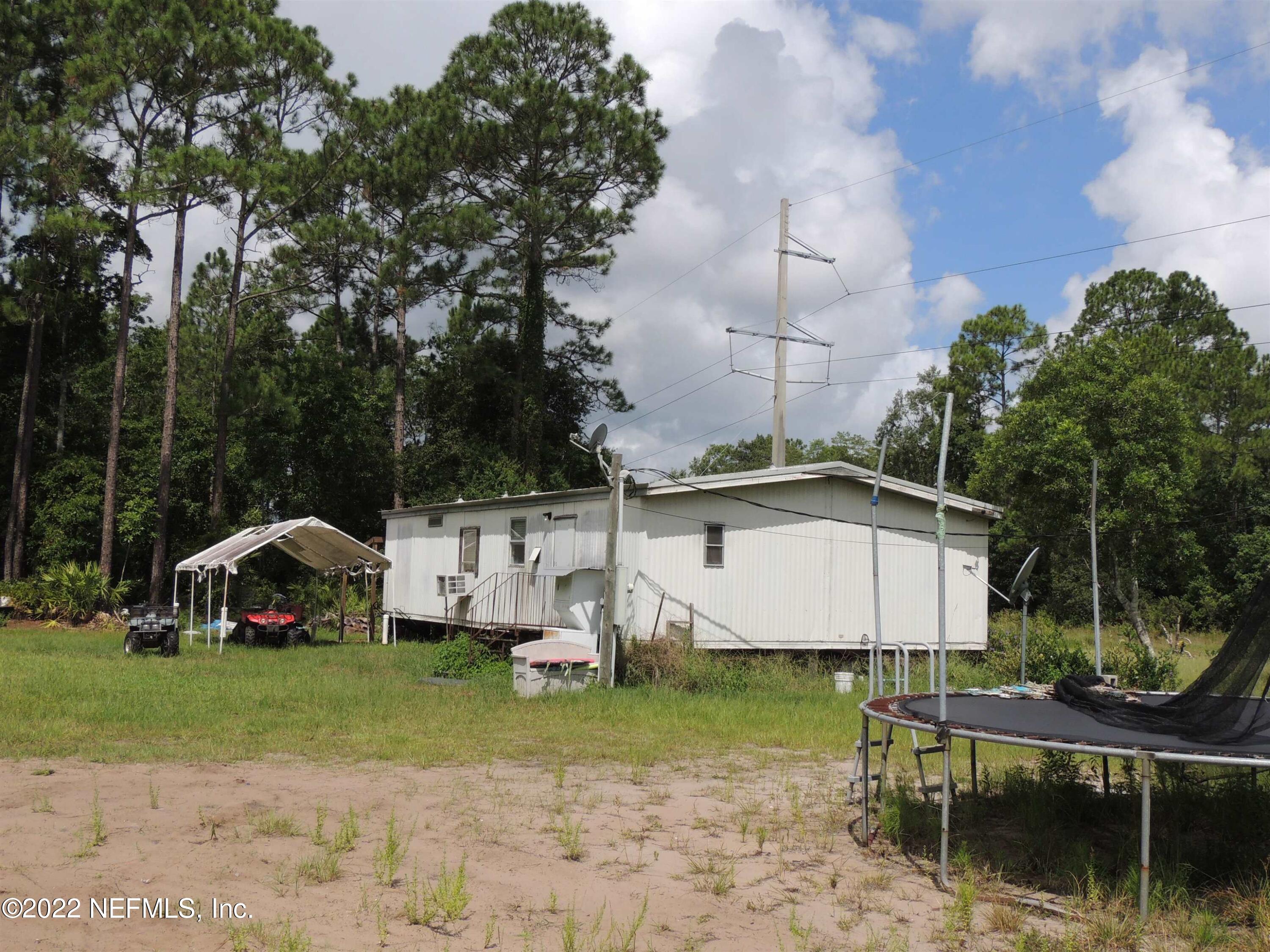 1801 Forbes Road St. Augustine, FL 32092 - Photo 19 of 28 a front view of a house with garden