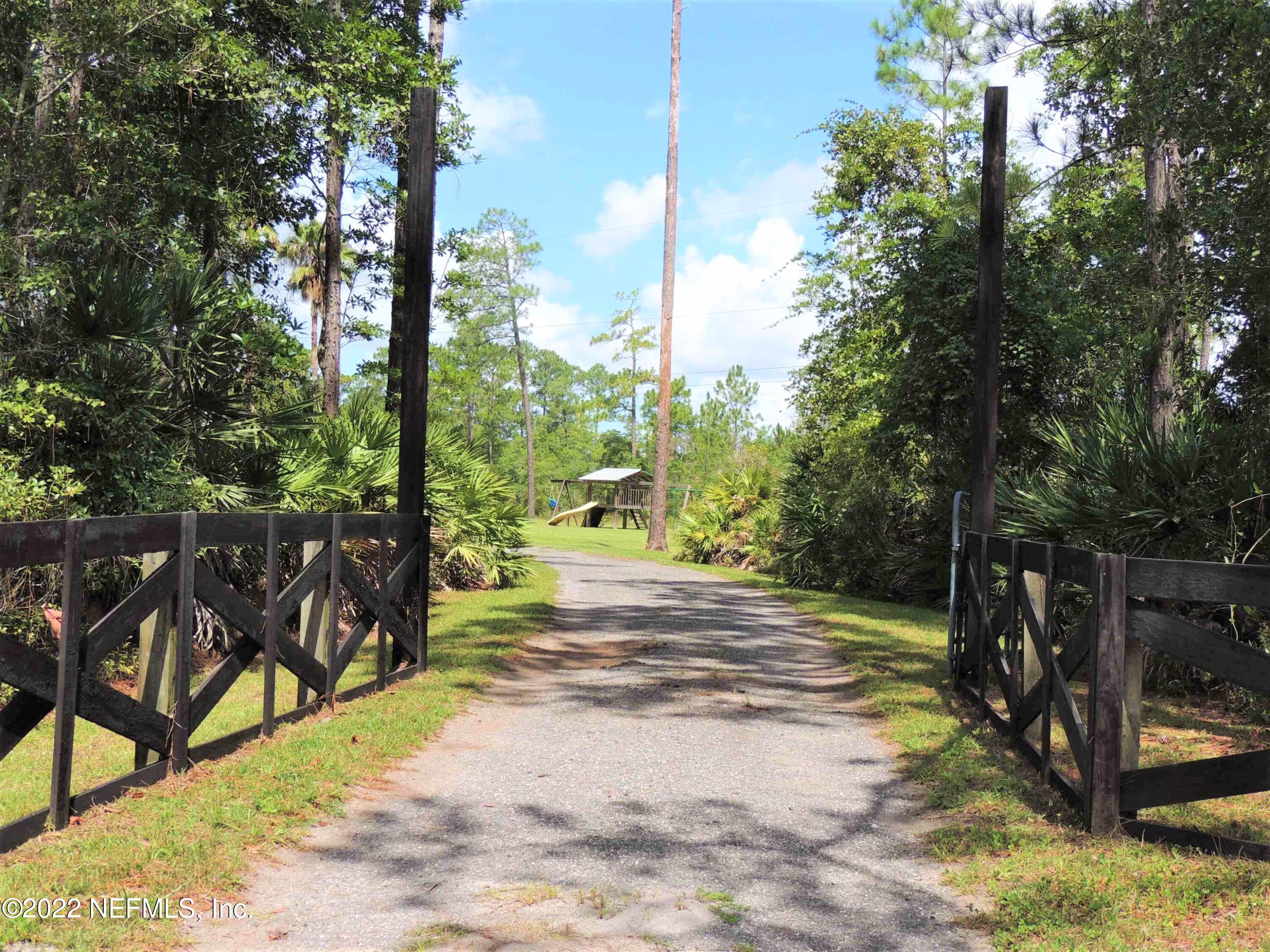 1801 Forbes Road St. Augustine, FL 32092 - Photo 2 of 28 a view of a yard with plants and trees
