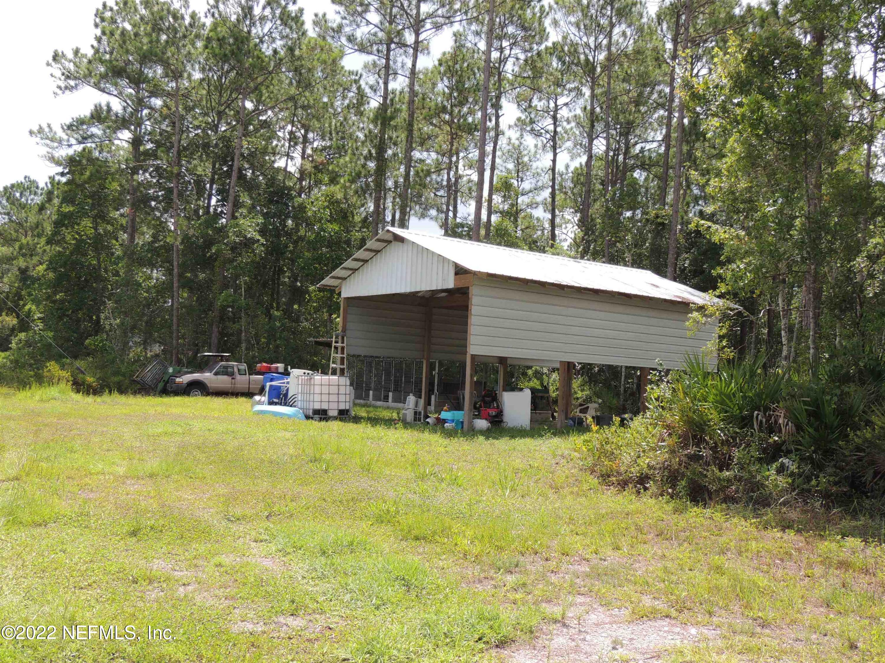 1801 Forbes Road St. Augustine, FL 32092 - Photo 21 of 28 a view of a house with swimming pool and sitting area