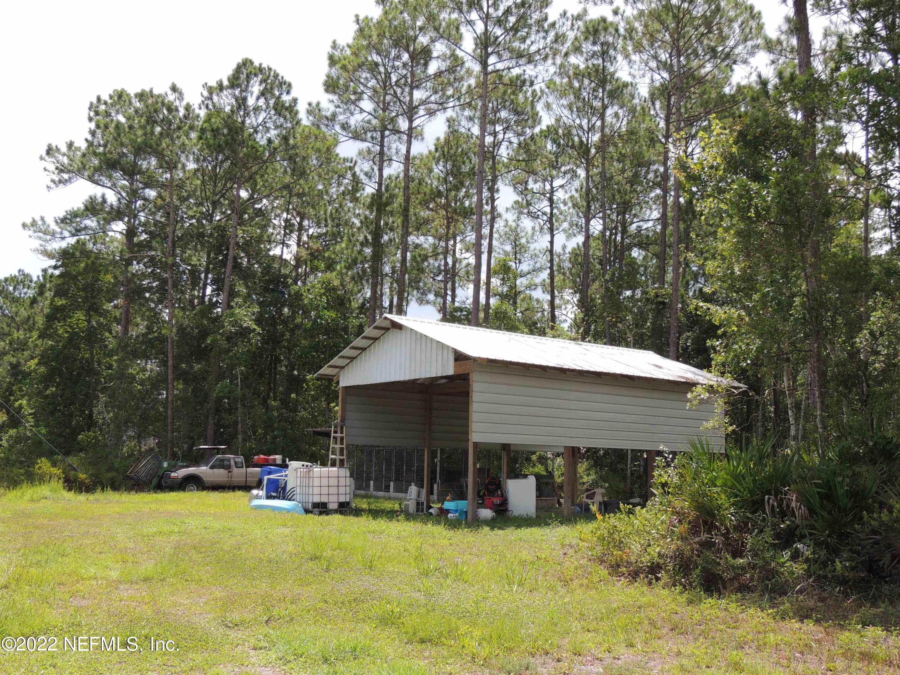 1801 Forbes Road St. Augustine, FL 32092 - Photo 22 of 28 a view of a house with swimming pool and sitting area