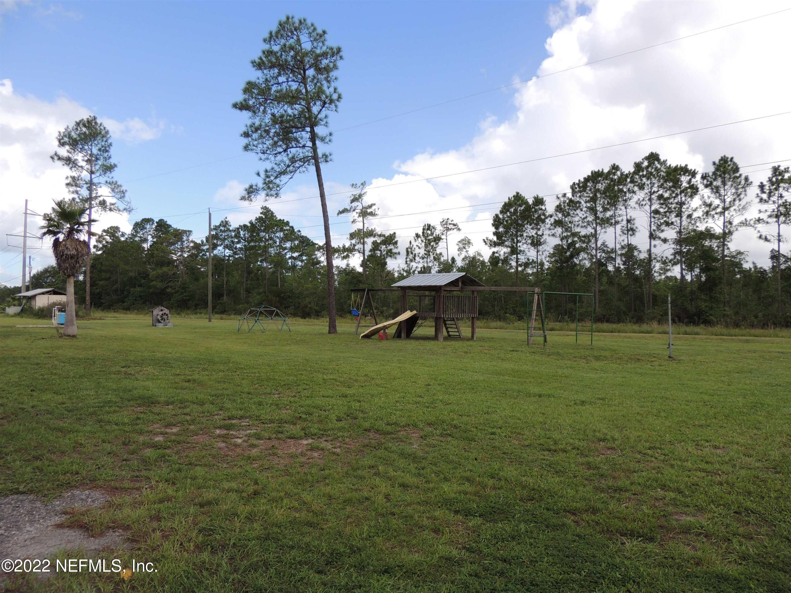 1801 Forbes Road St. Augustine, FL 32092 - Photo 23 of 28 a front view of a house with a yard
