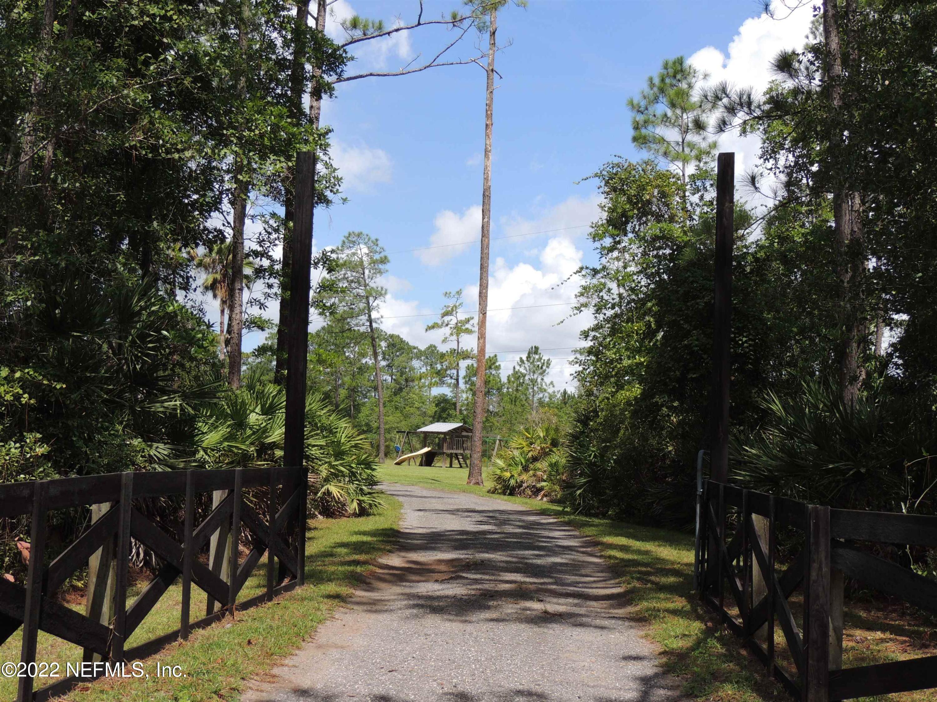 1801 Forbes Road St. Augustine, FL 32092 - Photo 28 of 28 a view of a yard with plants and trees