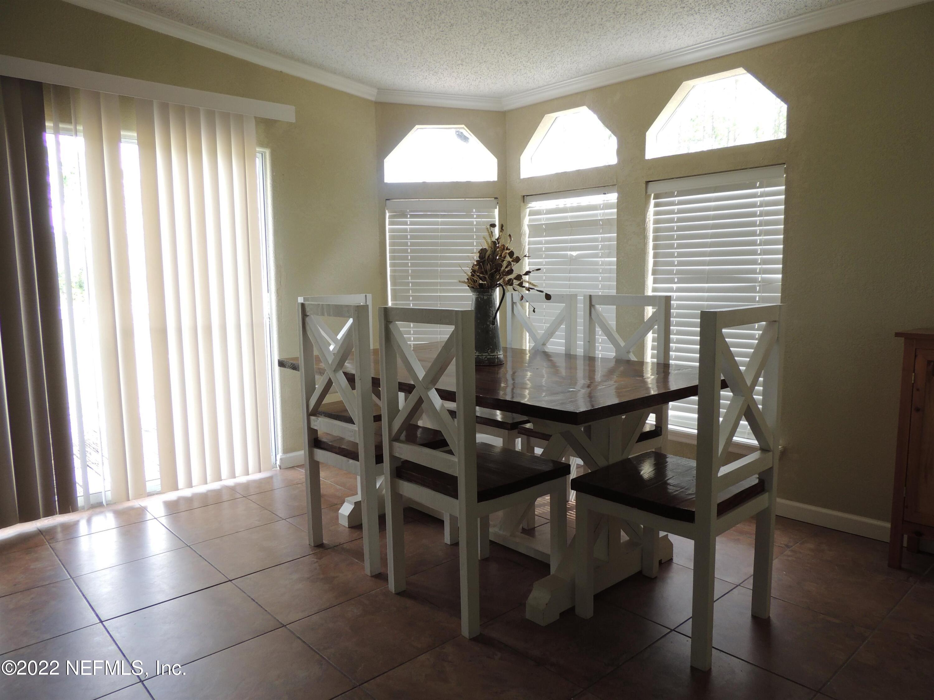 1801 Forbes Road St. Augustine, FL 32092 - Photo 5 of 28 a view of a dining room with furniture and window