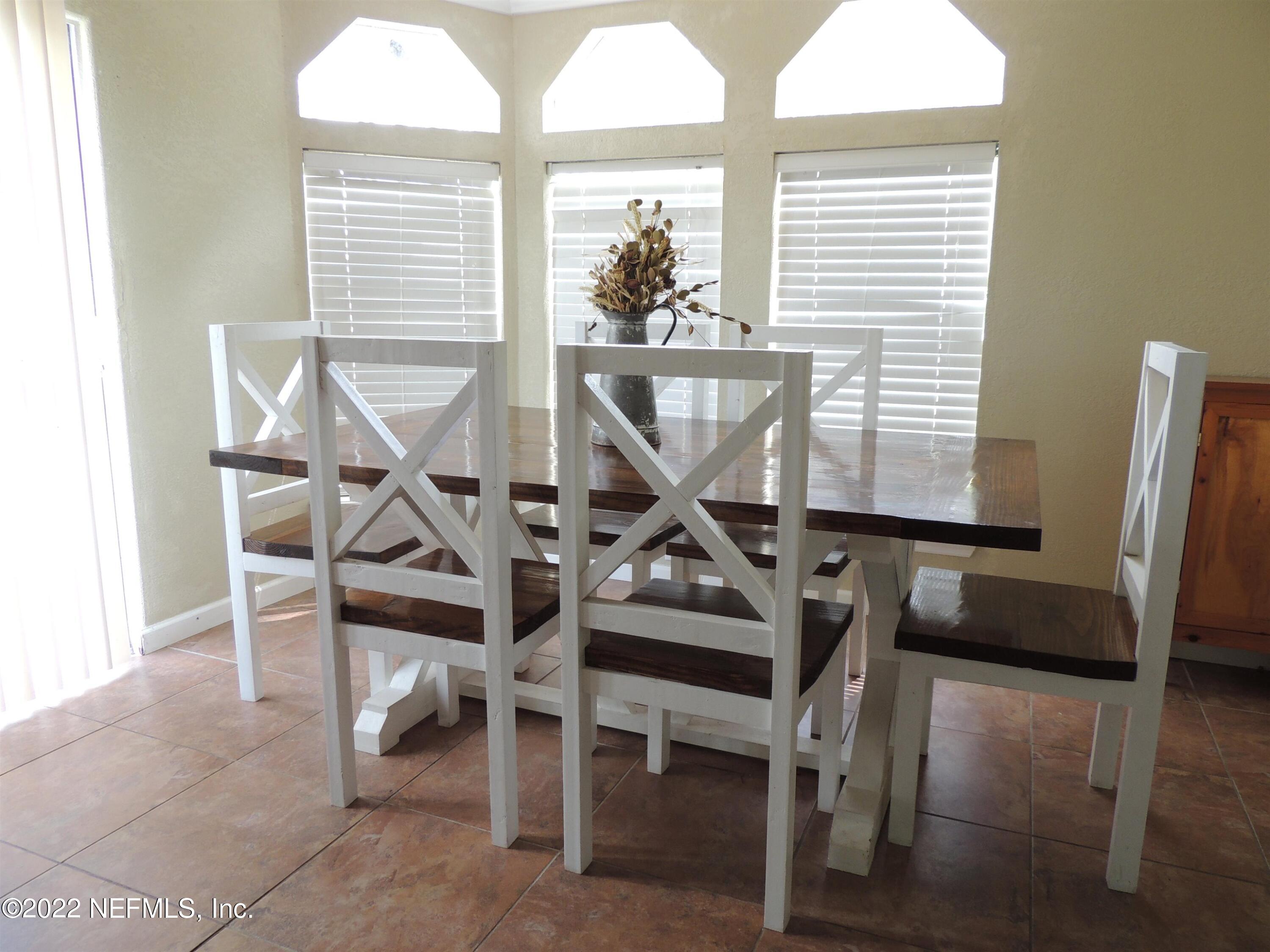 1801 Forbes Road St. Augustine, FL 32092 - Photo 6 of 28 a view of a workspace with furniture and a window