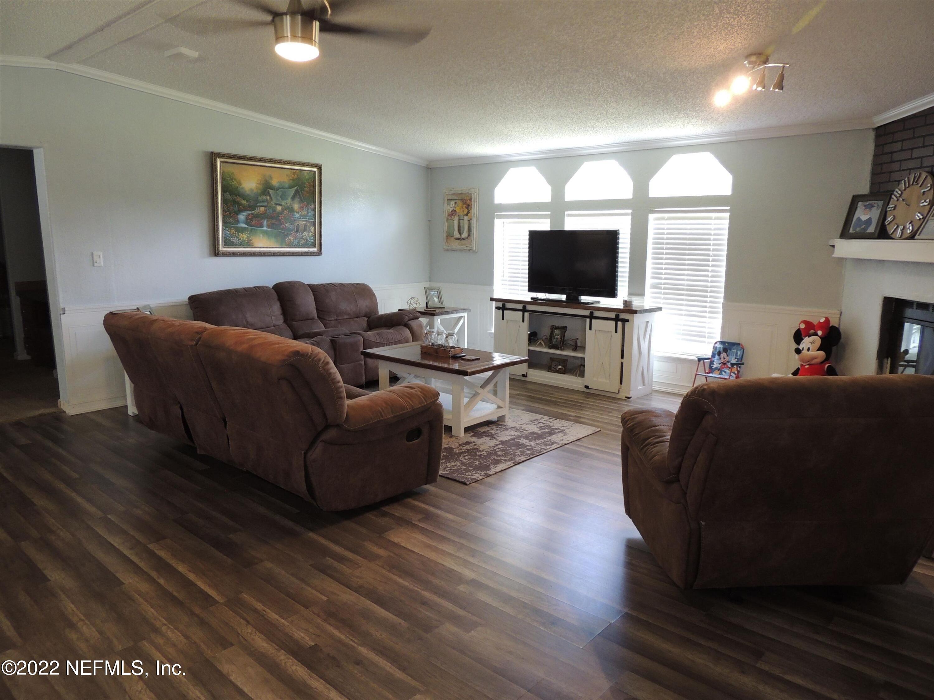 1801 Forbes Road St. Augustine, FL 32092 - Photo 7 of 28 a living room with furniture and a flat screen tv