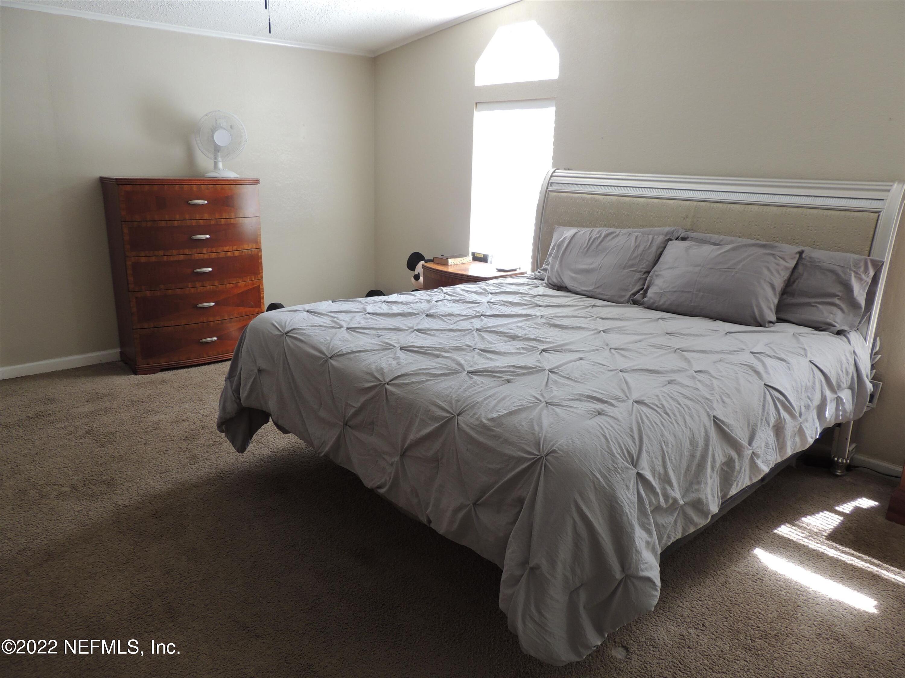 1801 Forbes Road St. Augustine, FL 32092 - Photo 10 of 28 a bedroom with a bed and window