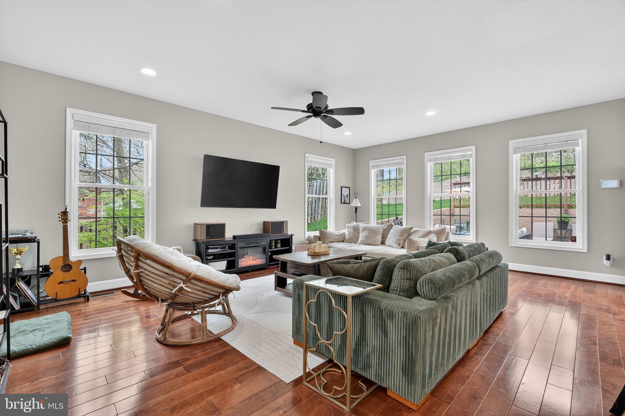 3112 Spring Drive Alexandria, VA 22306 - Photo 12 of 58 a living room with fireplace furniture and a flat screen tv