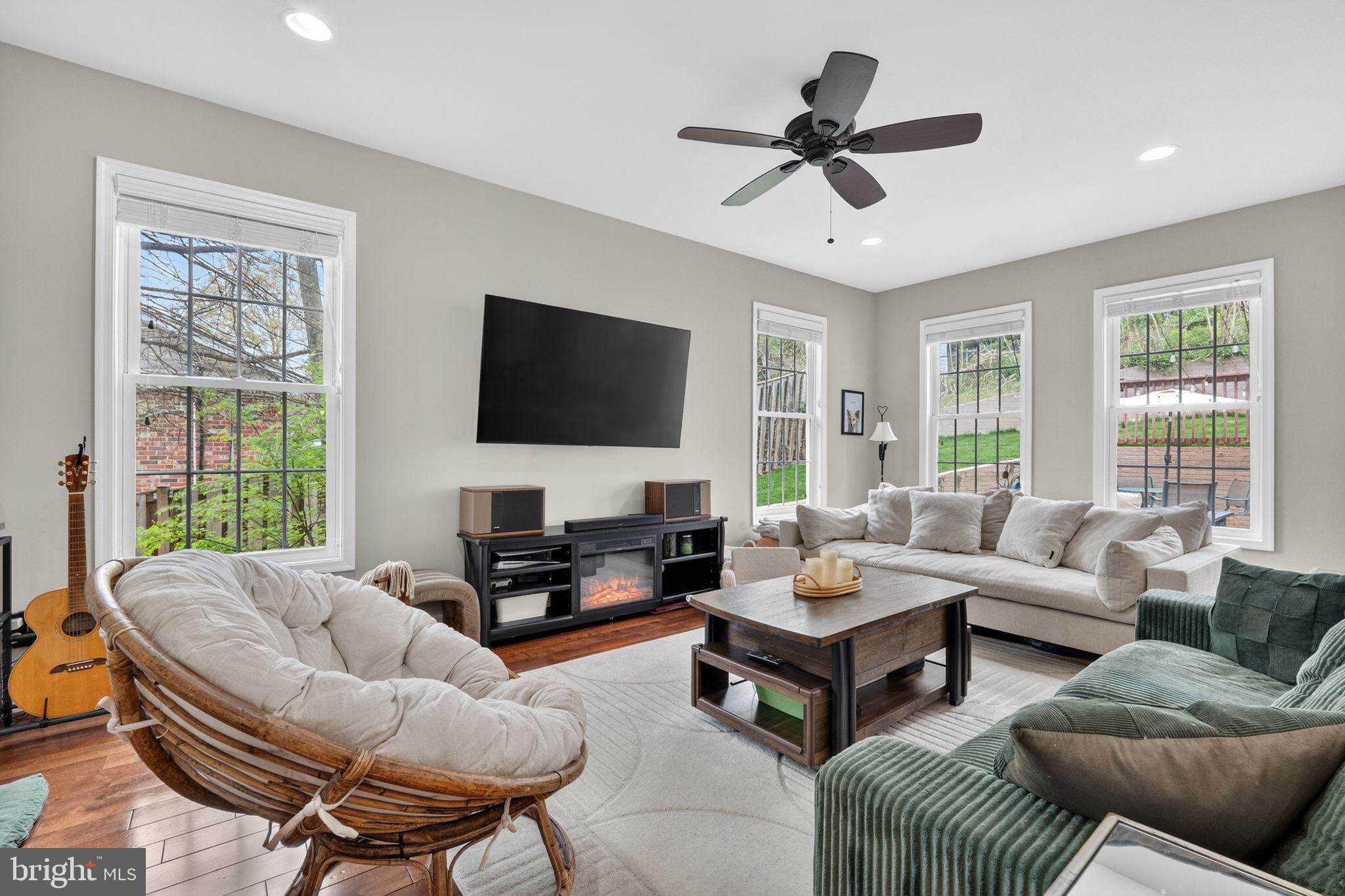 3112 Spring Drive Alexandria, VA 22306 - Photo 13 of 58 a living room with furniture a flat screen tv and a large window