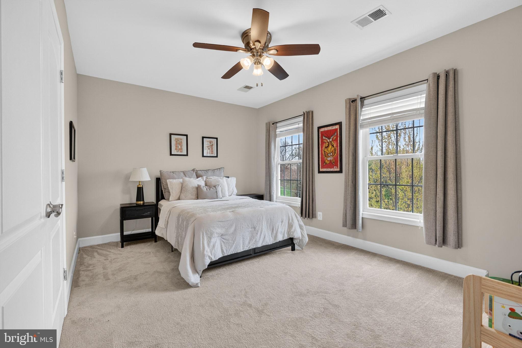 3112 Spring Drive Alexandria, VA 22306 - Photo 29 of 58 a spacious bedroom with a bed and a large window