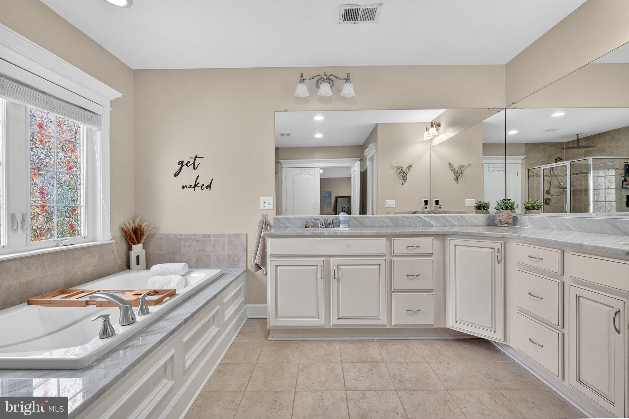 3112 Spring Drive Alexandria, VA 22306 - Photo 40 of 58 a spacious bathroom with a granite countertop sink mirror and a