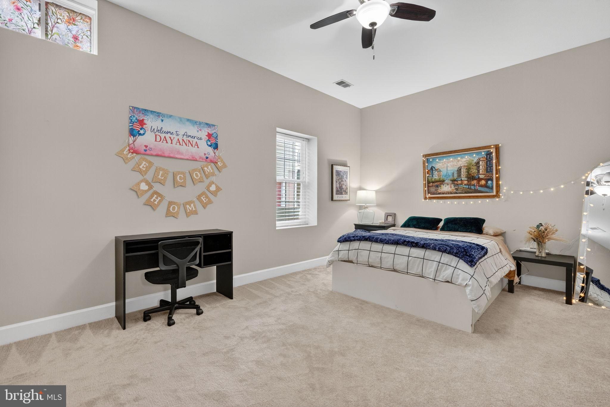 3112 Spring Drive Alexandria, VA 22306 - Photo 45 of 58 a bedroom with a bed and a chandelier