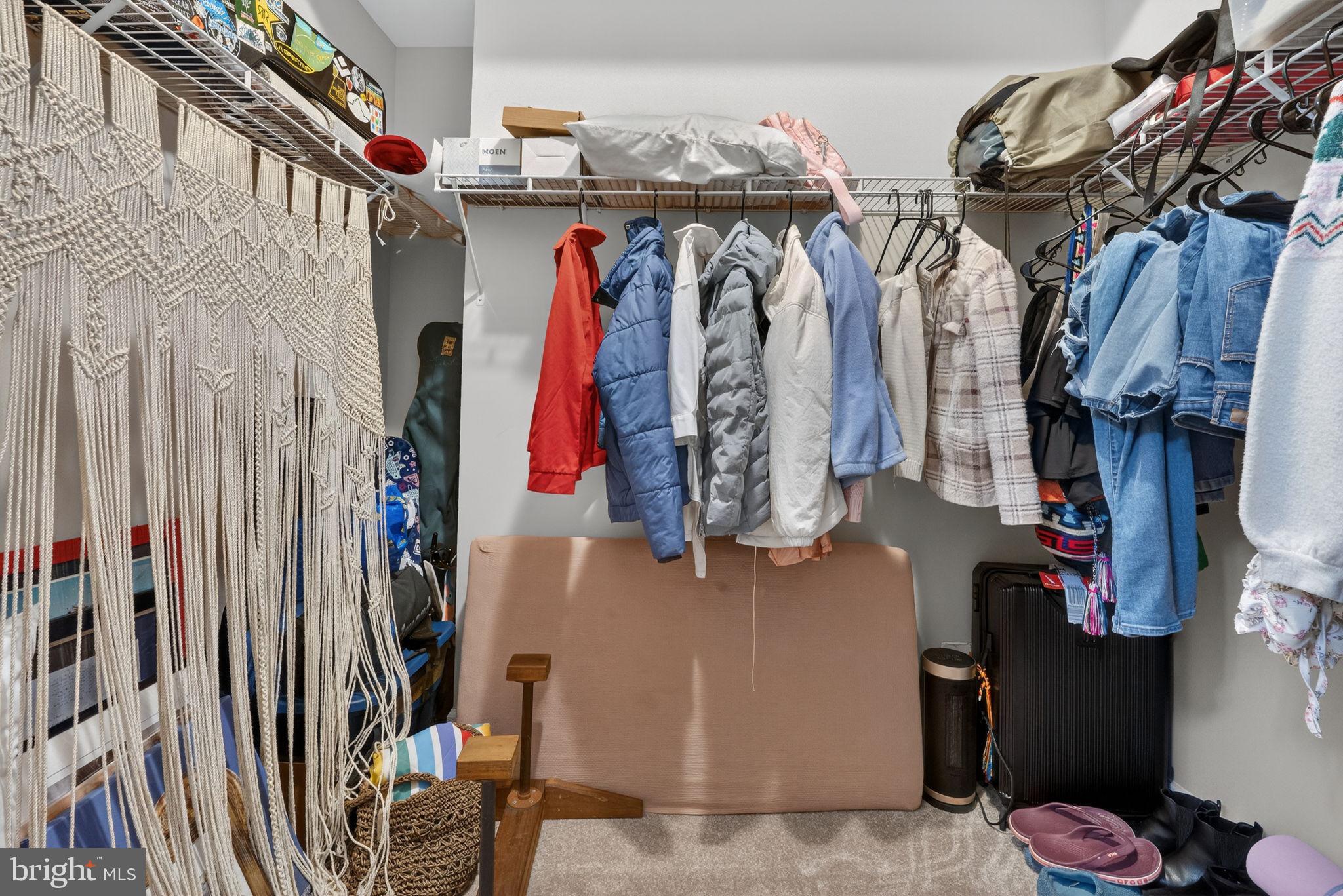 3112 Spring Drive Alexandria, VA 22306 - Photo 48 of 58 a view of walk in closet with clothes