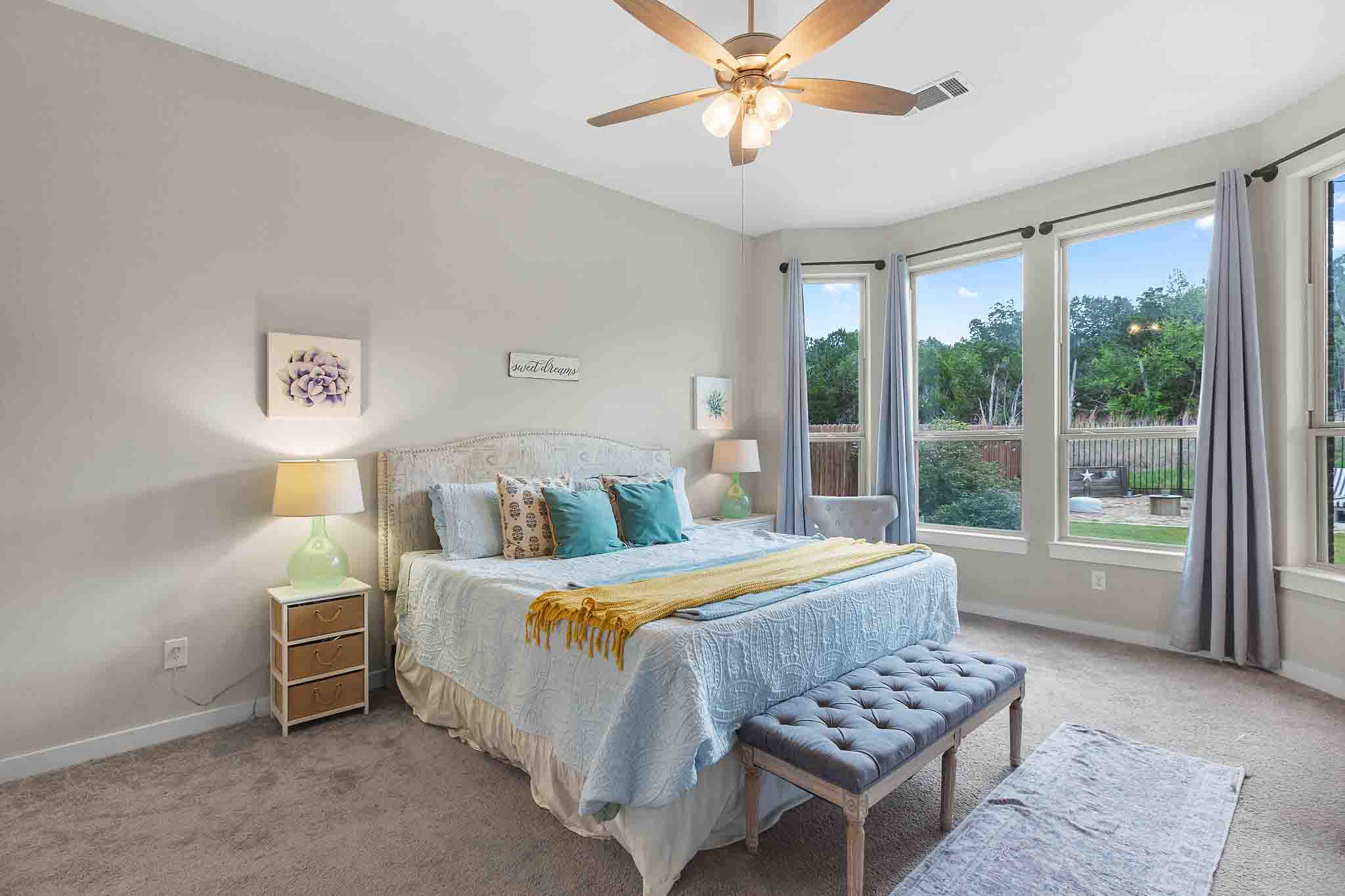 7717 Pace Ravine Drive Lago Vista, TX 78645 - Photo 17 of 39 a bedroom with a bed dresser and a window