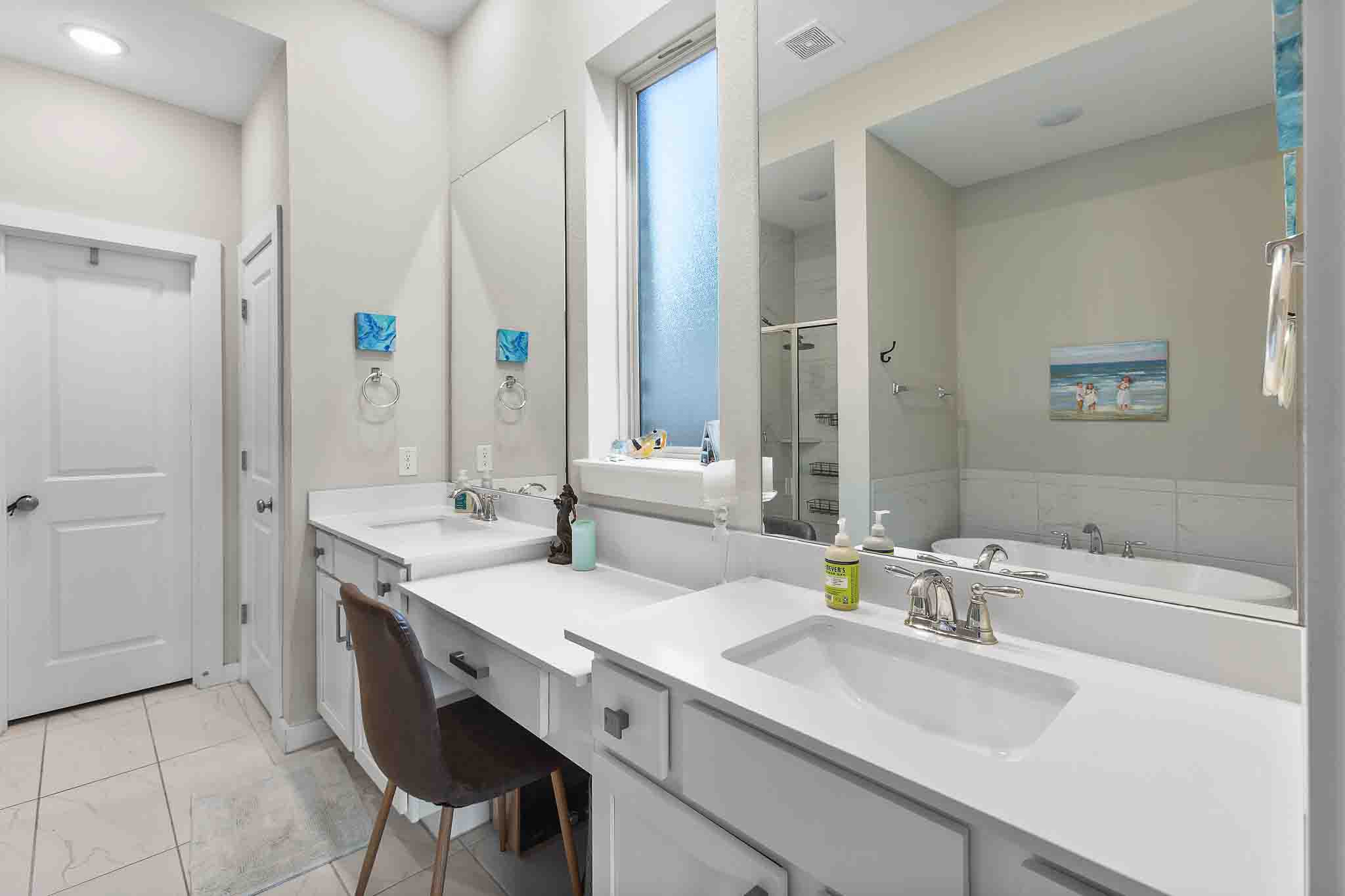 7717 Pace Ravine Drive Lago Vista, TX 78645 - Photo 18 of 39 a bathroom with a double vanity sink mirror and double