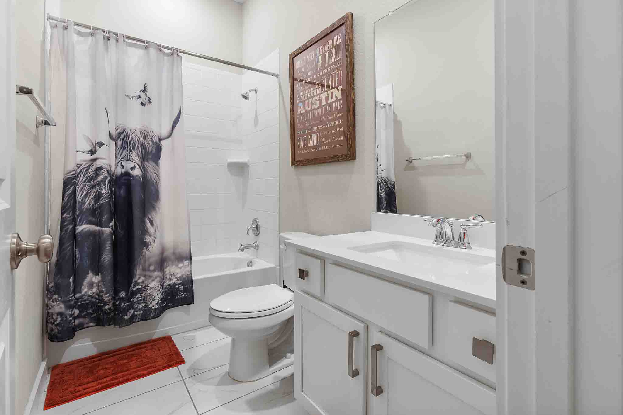 7717 Pace Ravine Drive Lago Vista, TX 78645 - Photo 21 of 39 a bathroom with a sink toilet and shower