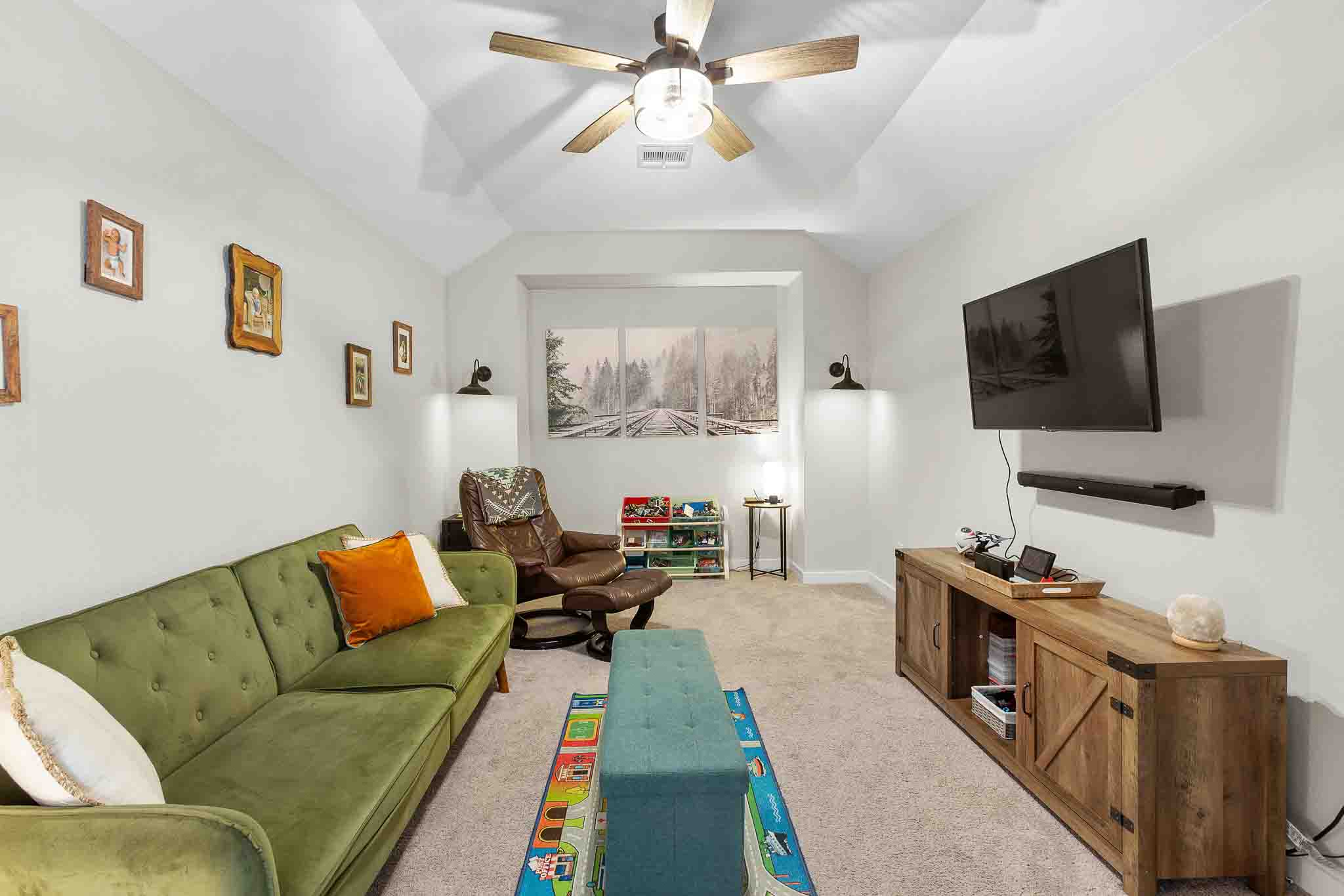 7717 Pace Ravine Drive Lago Vista, TX 78645 - Photo 23 of 39 a living room with furniture and a flat screen tv