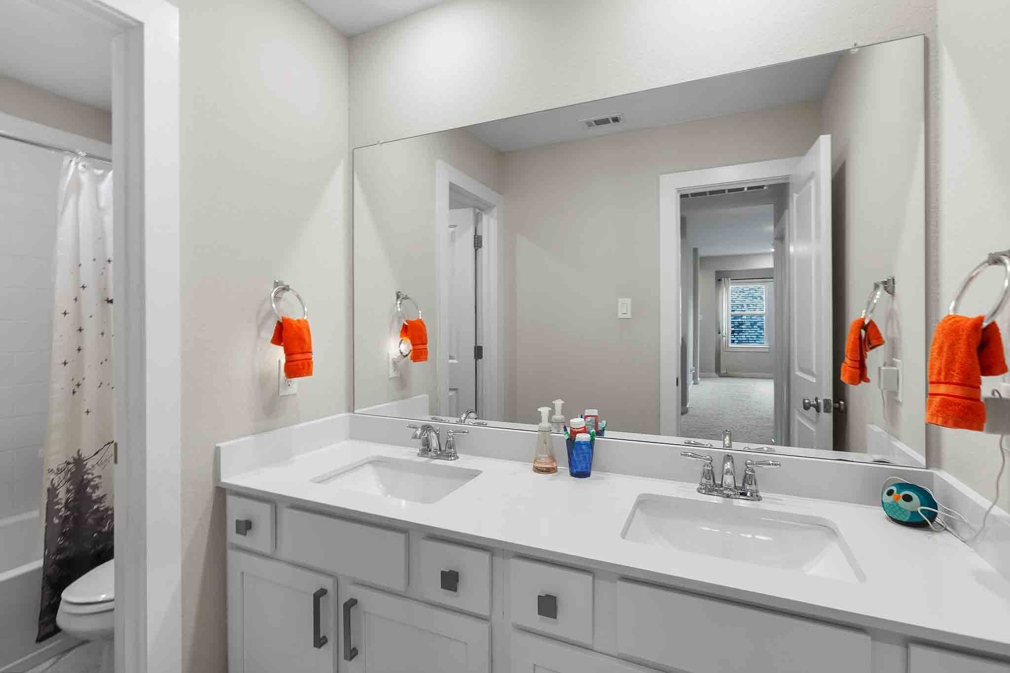 7717 Pace Ravine Drive Lago Vista, TX 78645 - Photo 26 of 39 a bathroom with a granite countertop sink and a mirror