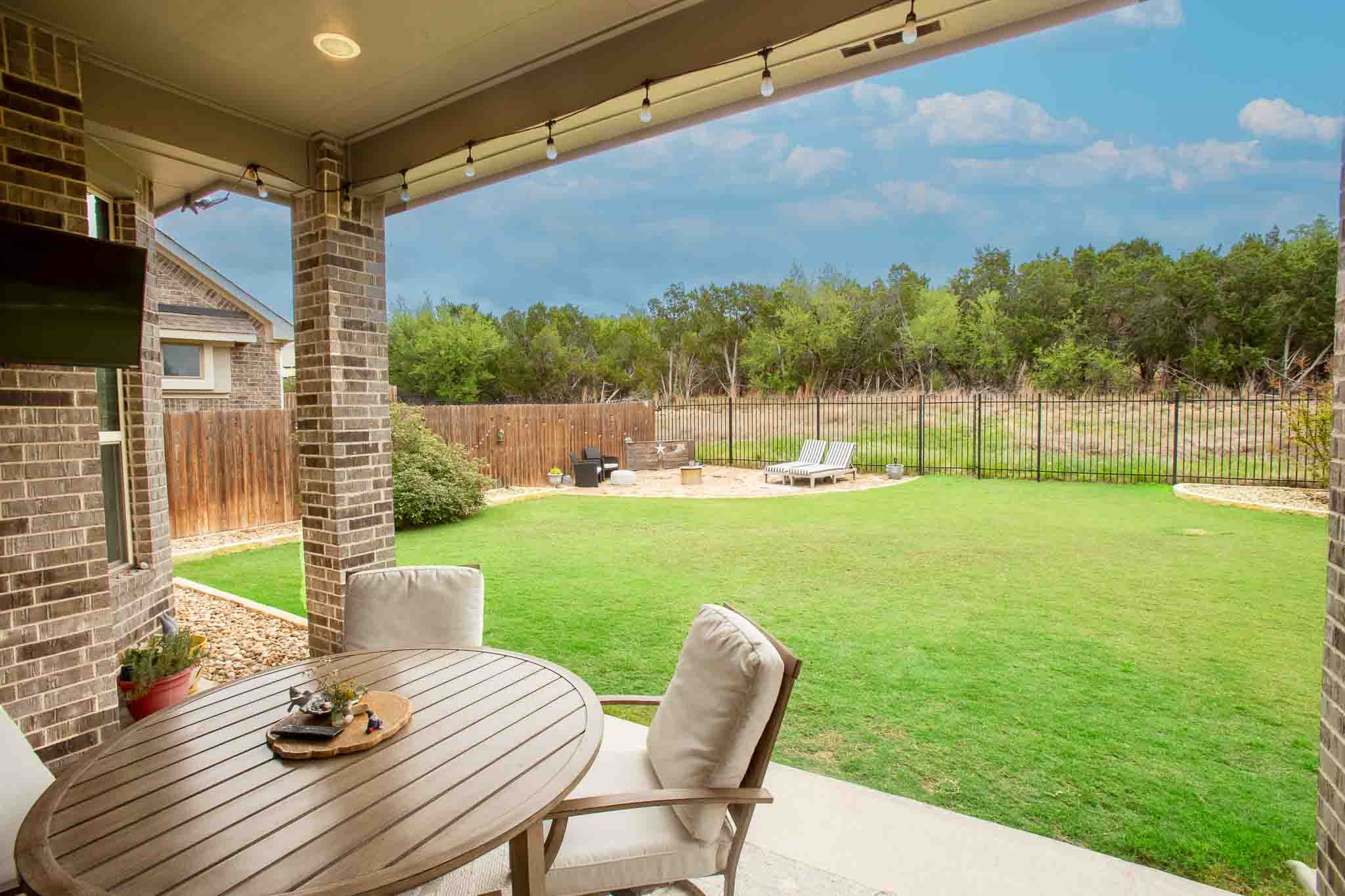 7717 Pace Ravine Drive Lago Vista, TX 78645 - Photo 27 of 39 a view of a chair and table in the patio