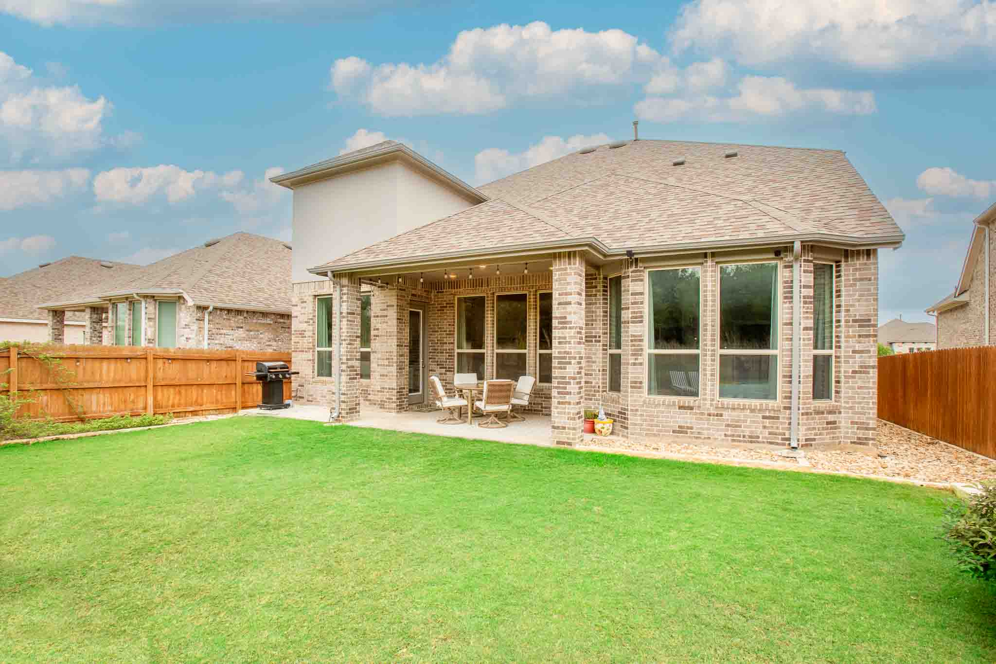 7717 Pace Ravine Drive Lago Vista, TX 78645 - Photo 29 of 39 a view of a house with a yard and sitting area