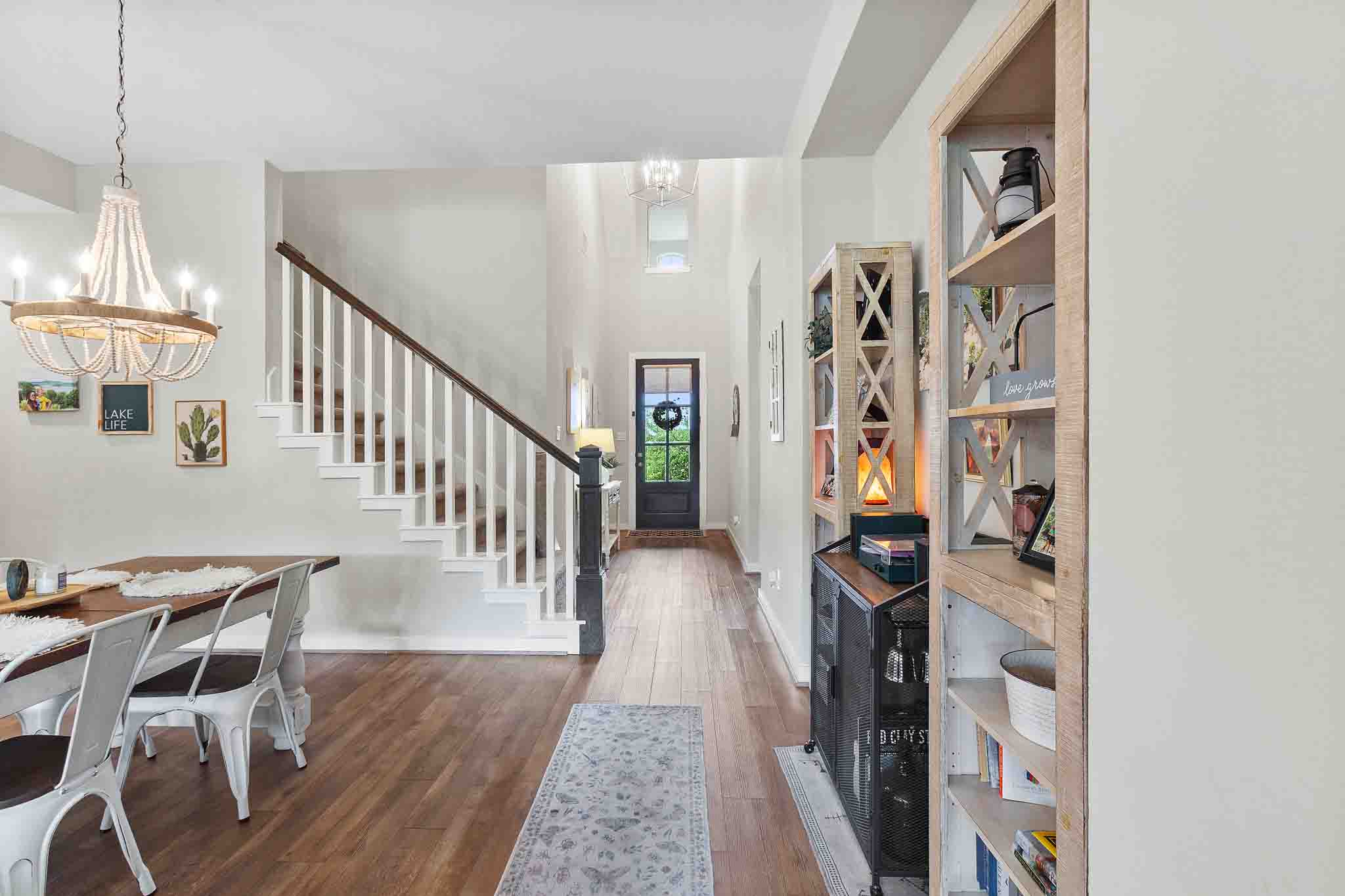 7717 Pace Ravine Drive Lago Vista, TX 78645 - Photo 3 of 39 a view of a hallway with wooden floor and entryway