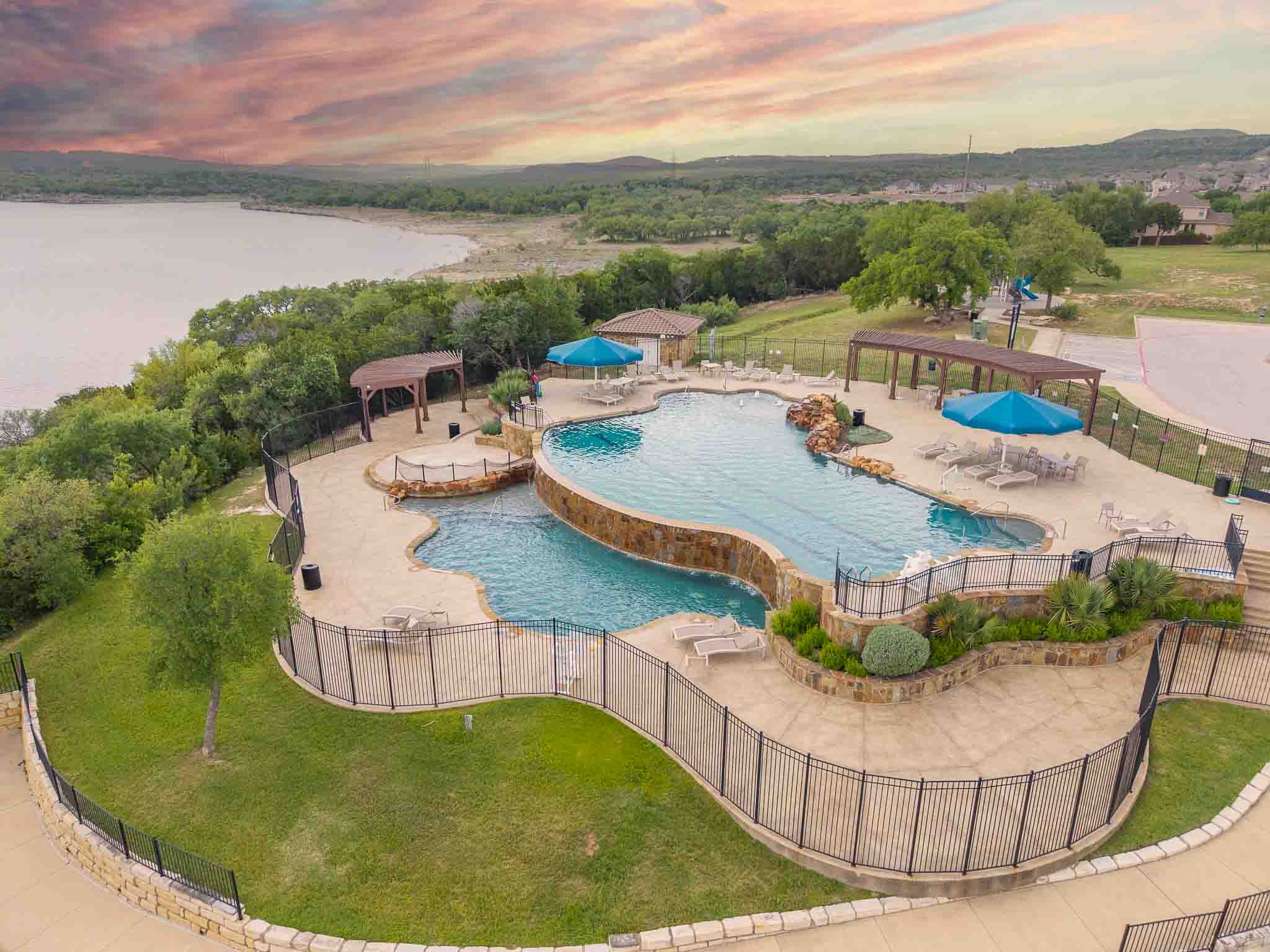 7717 Pace Ravine Drive Lago Vista, TX 78645 - Photo 35 of 39 a view of a swimming pool with lounge chair