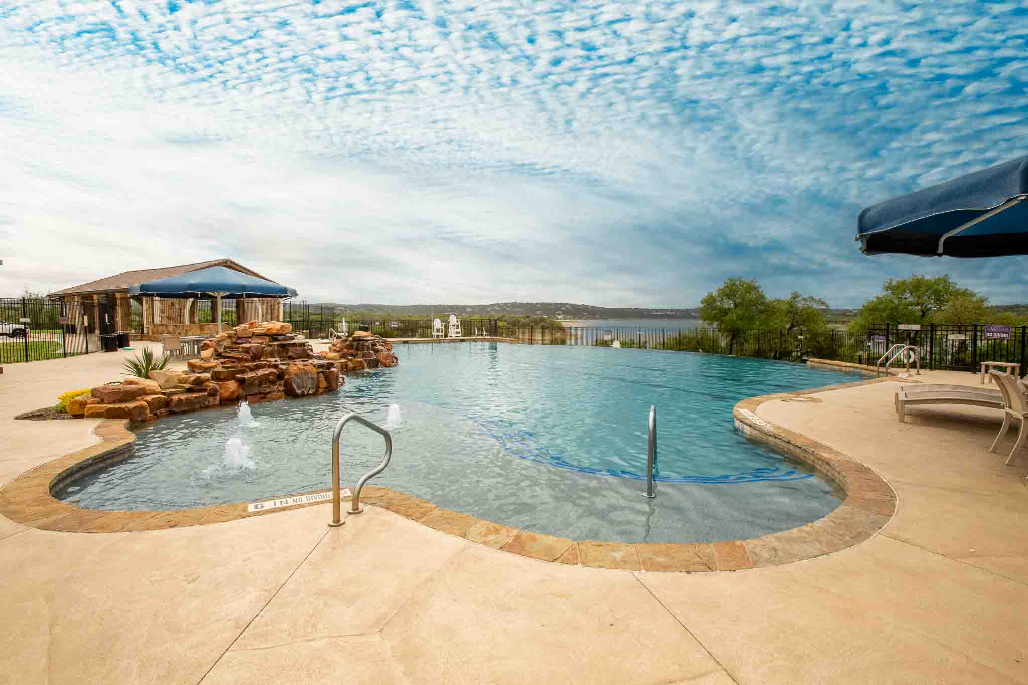 7717 Pace Ravine Drive Lago Vista, TX 78645 - Photo 36 of 39 swimming pool view with a seating space