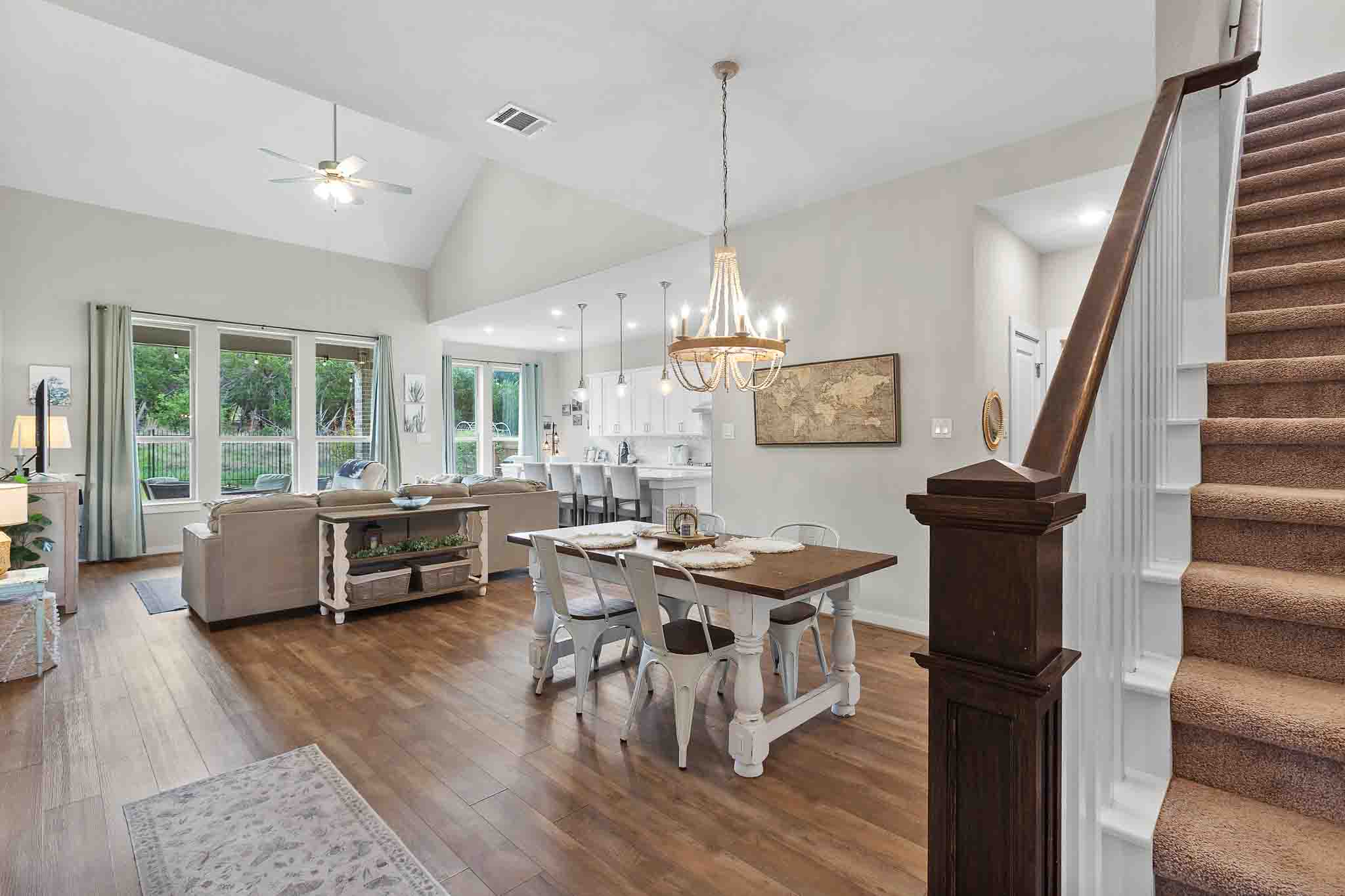 7717 Pace Ravine Drive Lago Vista, TX 78645 - Photo 4 of 39 a view of a dining room with furniture window and wooden floor