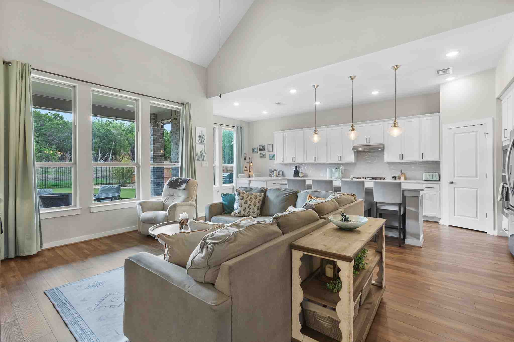 7717 Pace Ravine Drive Lago Vista, TX 78645 - Photo 6 of 39 a living room with furniture and a large window