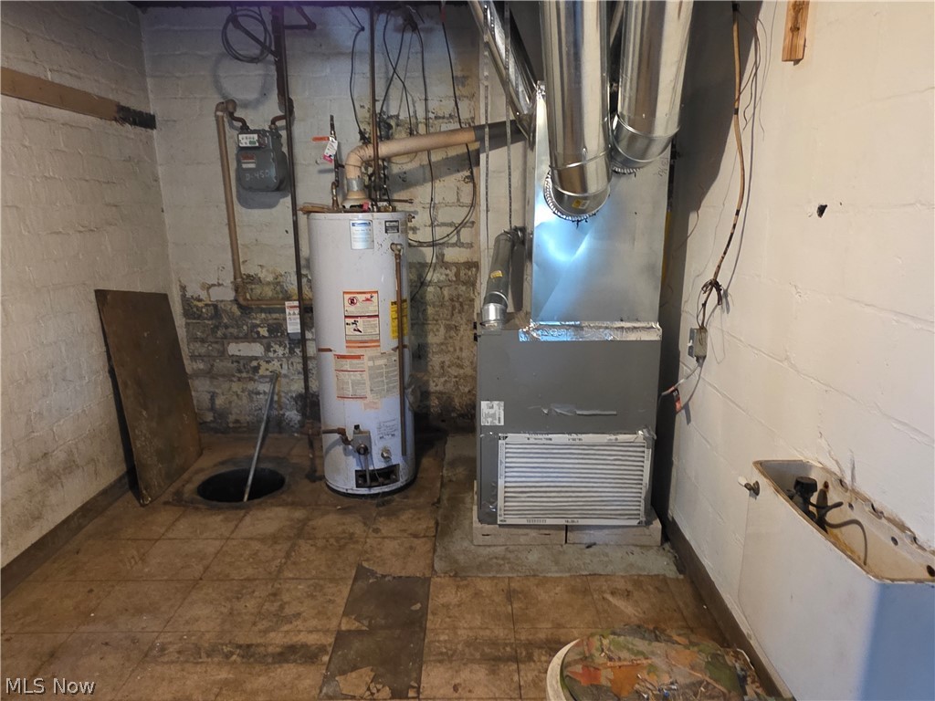 1801 West Prospect Road Ashtabula, OH 44004 - Photo 29 of 35 utility room where furnace is and hot water tank.