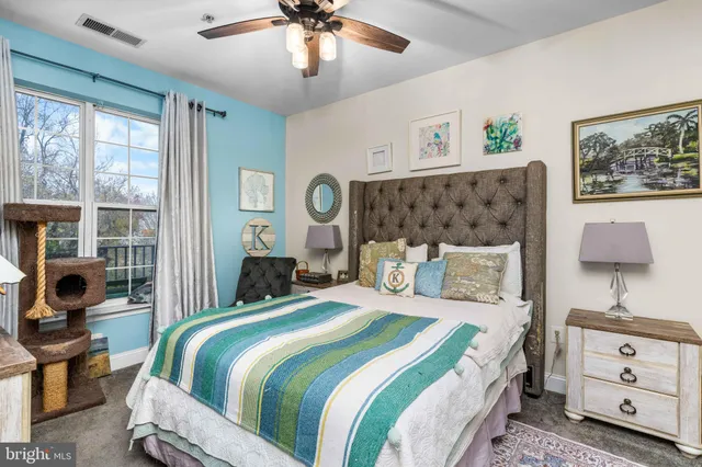 a bedroom with a bed and furniture with outer view