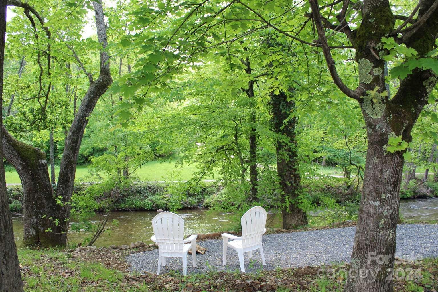 505 Mundy Field Road Canton, NC 28716 - Photo 14 of 22 a view of a house with a yard and sitting area