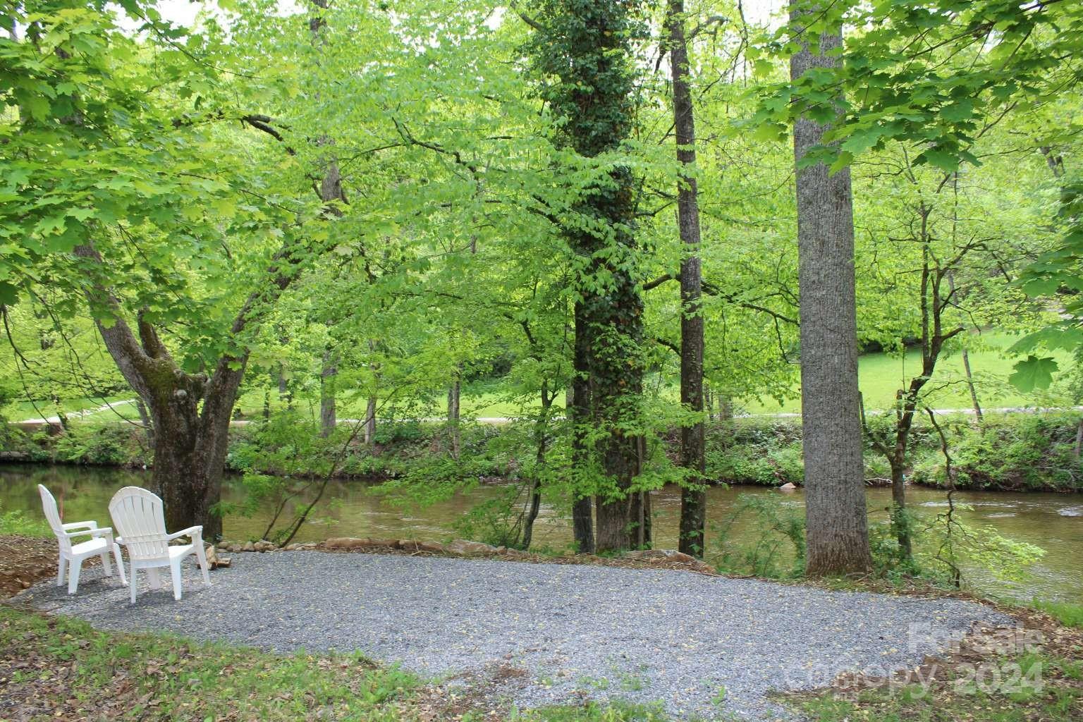 505 Mundy Field Road Canton, NC 28716 - Photo 17 of 22 a view of a table and chairs in the garden