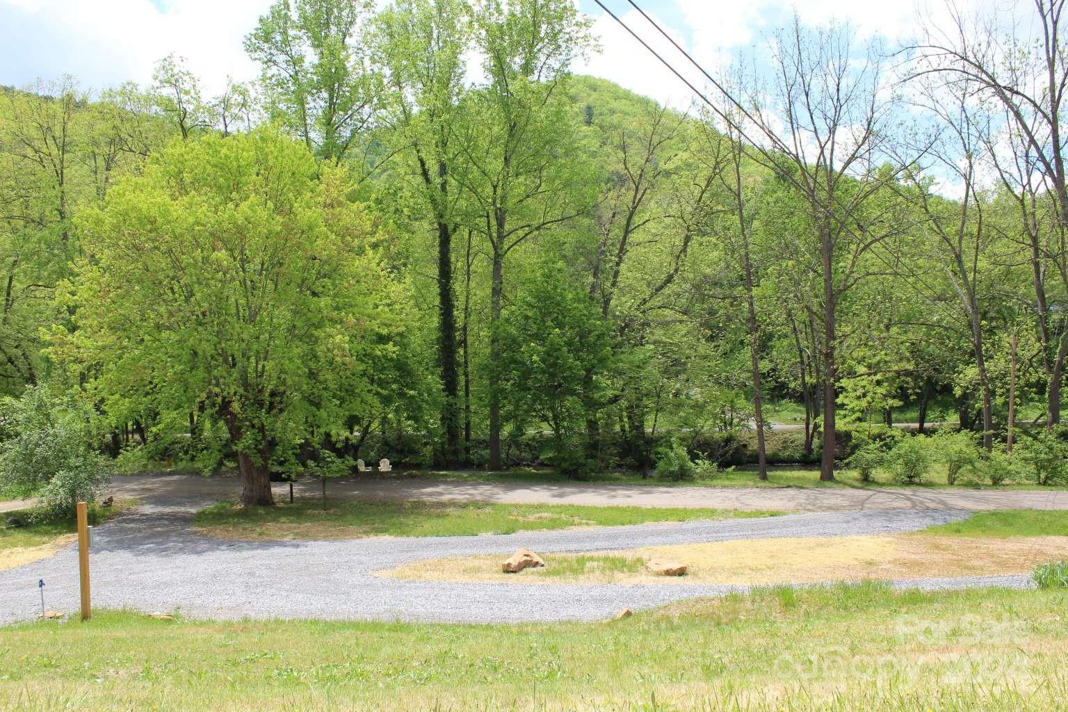 505 Mundy Field Road Canton, NC 28716 - Photo 6 of 22 a view of a yard with large trees