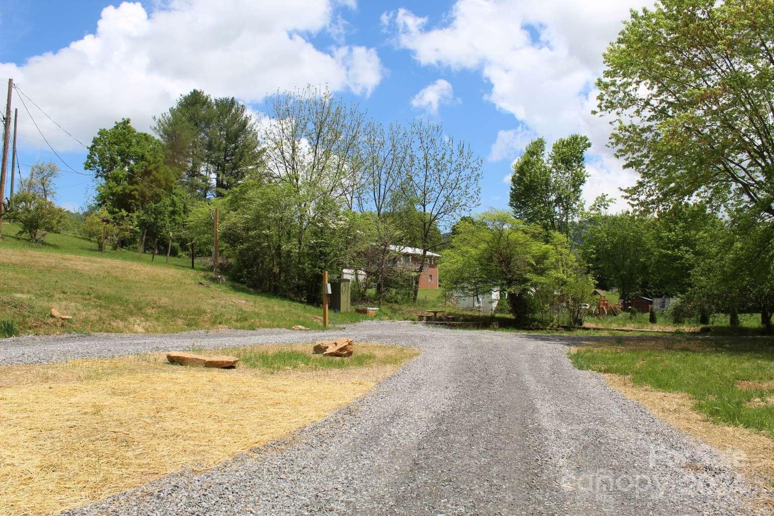 505 Mundy Field Road Canton, NC 28716 - Photo 7 of 22 a view of a swimming pool with an outdoor space and seating area