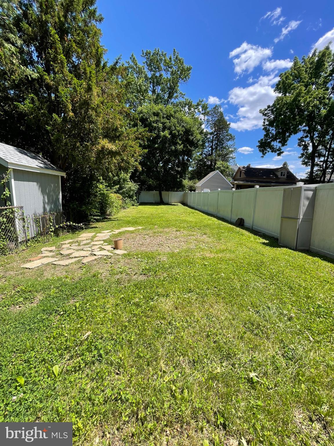 8129 Pine Road Philadelphia, PA 19111 - Photo 36 of 40 Spacious backyard with lush greenery.