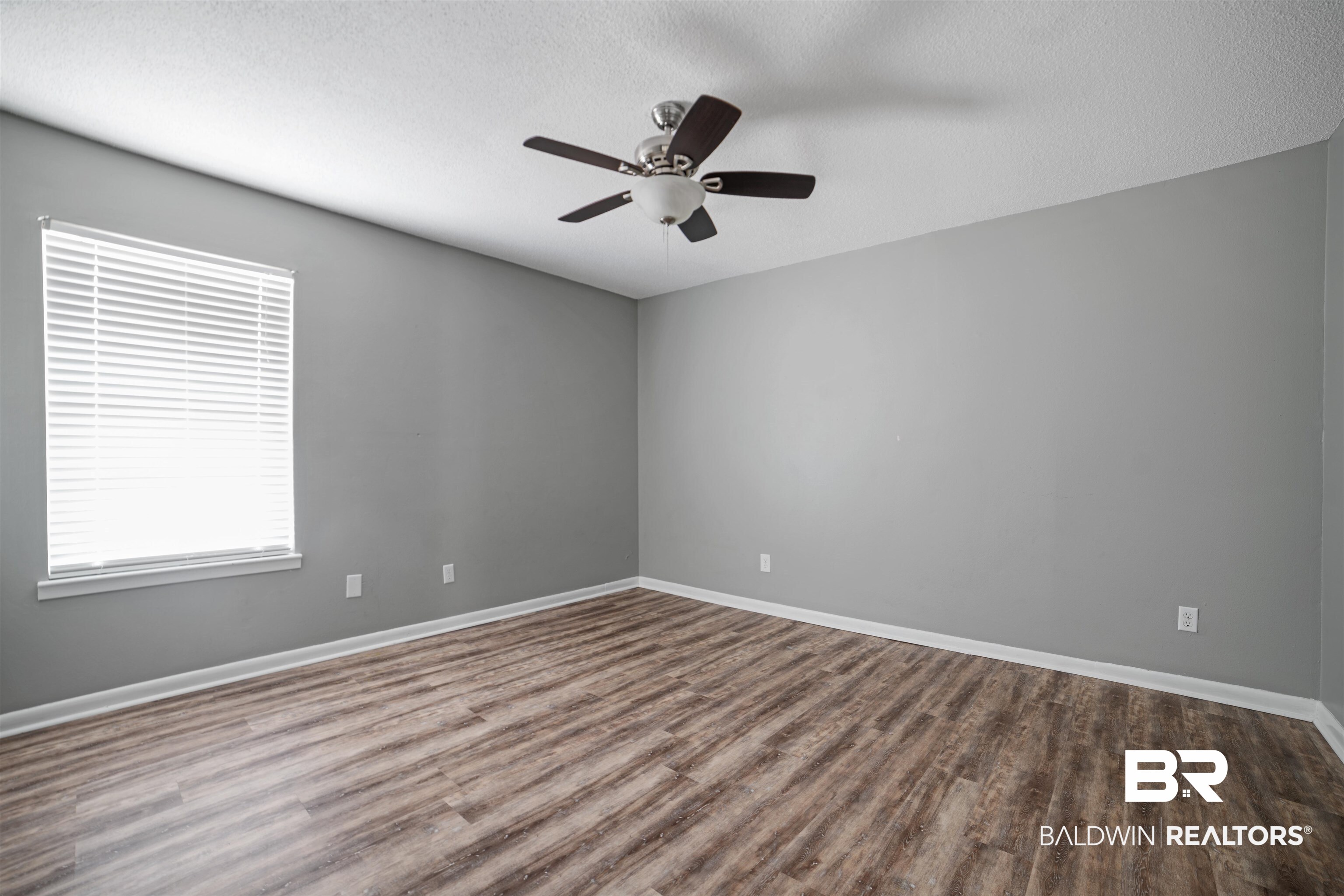 804 Regents Drive West Mobile, AL 36609 - Photo 27 of 35 Unfurnished room with a textured ceiling, a ceiling fan, and wood finished floors