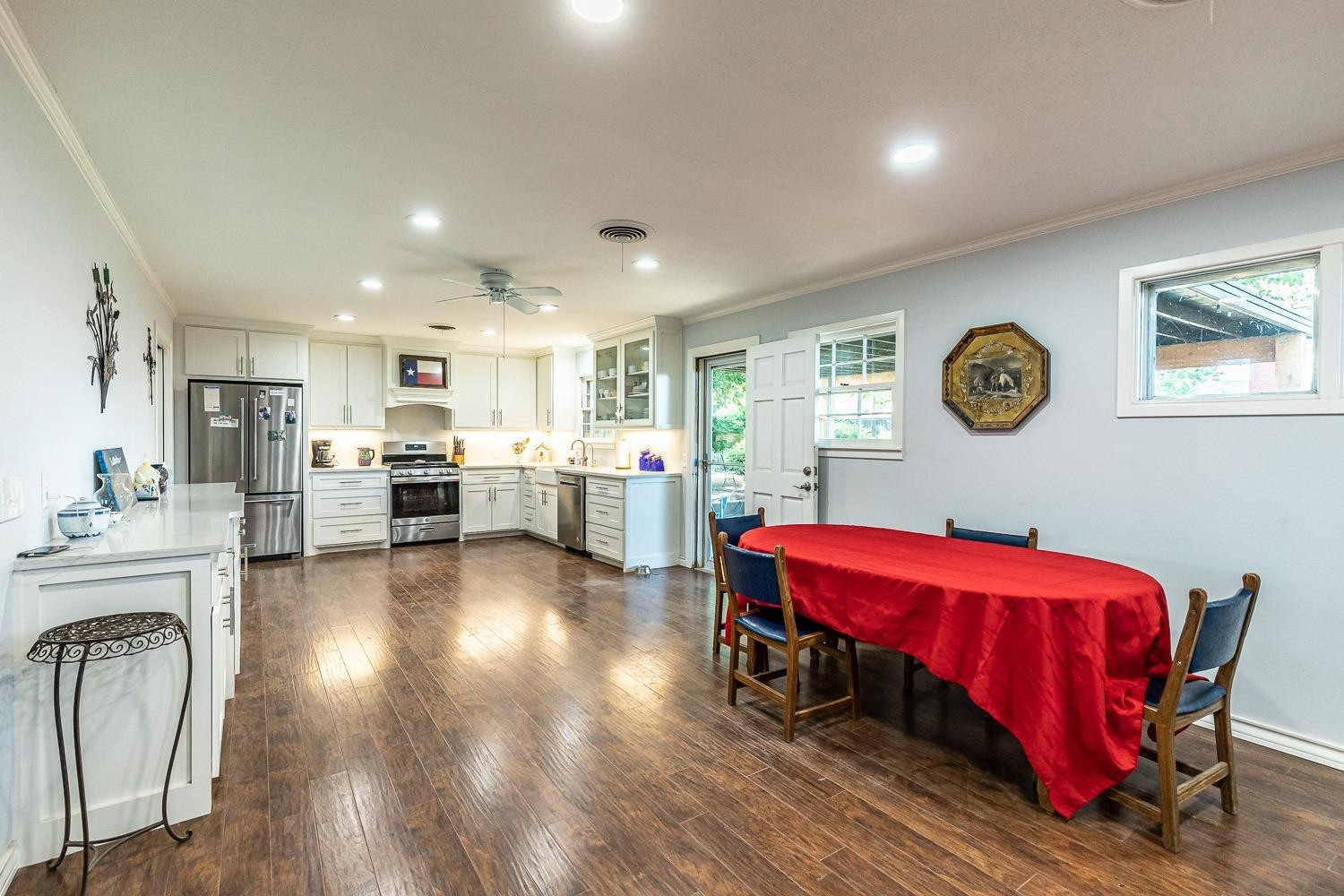 2327 60th Street Lubbock, TX 79412 - Photo 12 of 36 a living room with furniture and kitchen view