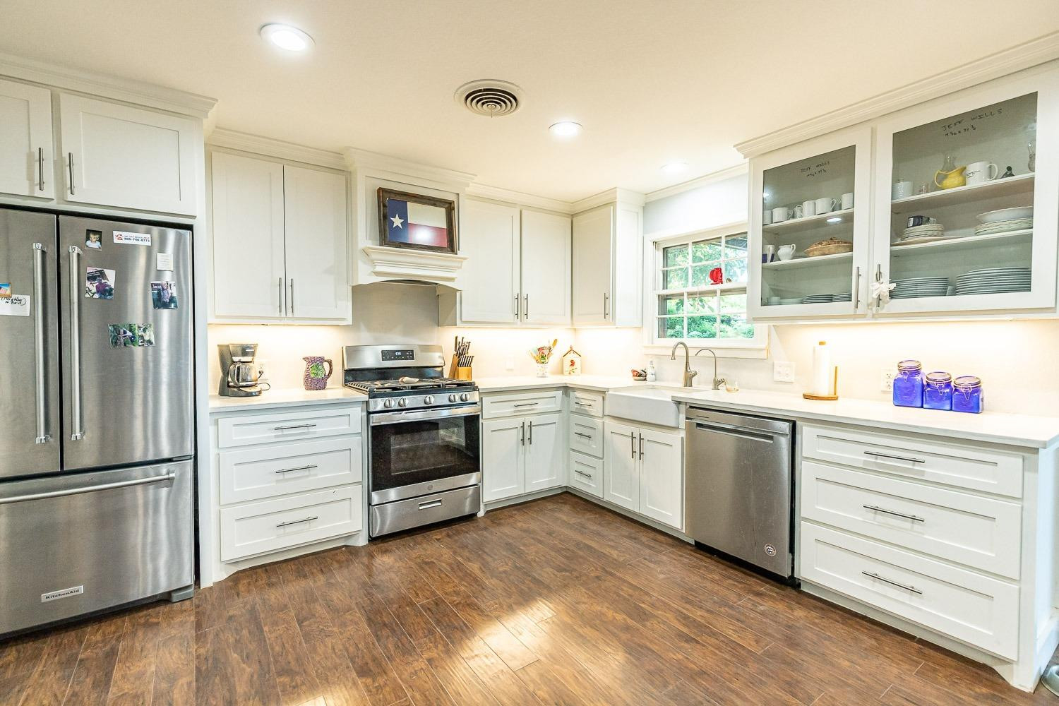 2327 60th Street Lubbock, TX 79412 - Photo 14 of 36 a kitchen with granite countertop stainless steel appliances and cabinets