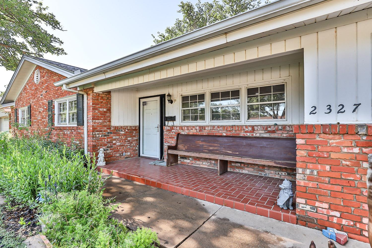 2327 60th Street Lubbock, TX 79412 - Photo 2 of 36 a backyard of a house with outdoor seating