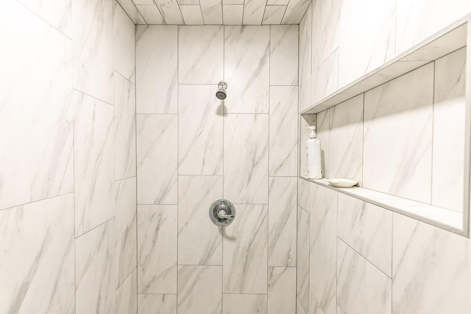 2327 60th Street Lubbock, TX 79412 - Photo 23 of 36 a bathroom with a shower