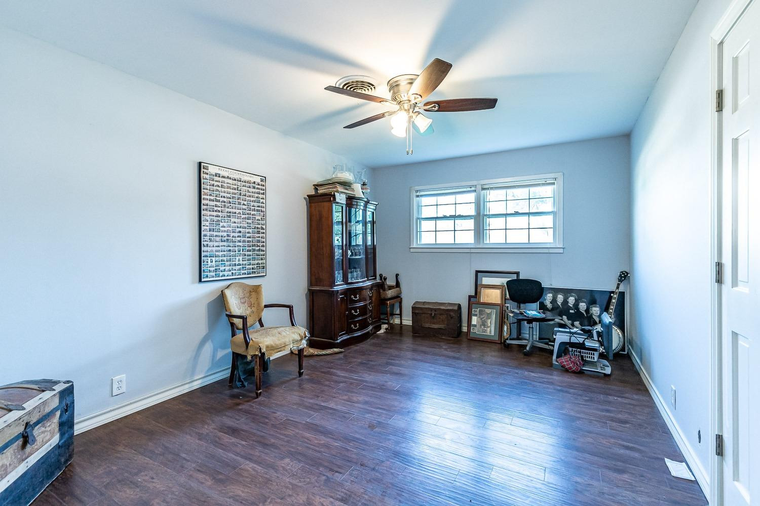 2327 60th Street Lubbock, TX 79412 - Photo 29 of 36 a living room with furniture and a window