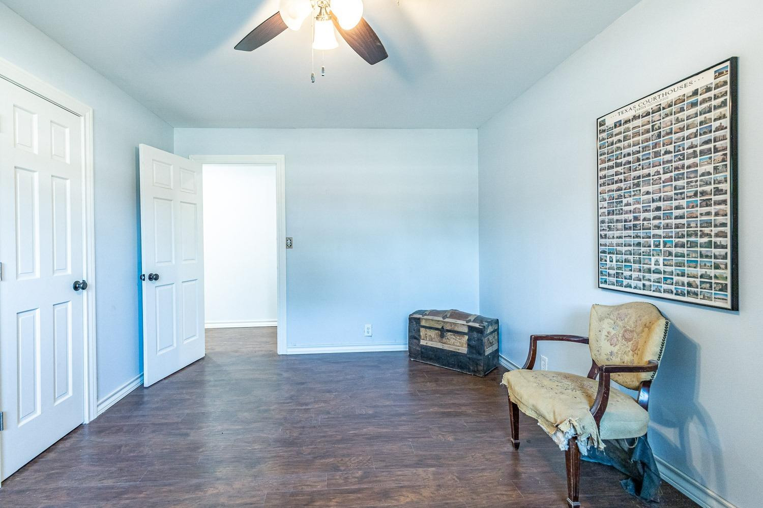 2327 60th Street Lubbock, TX 79412 - Photo 30 of 36 a view of room with furniture and wooden floor