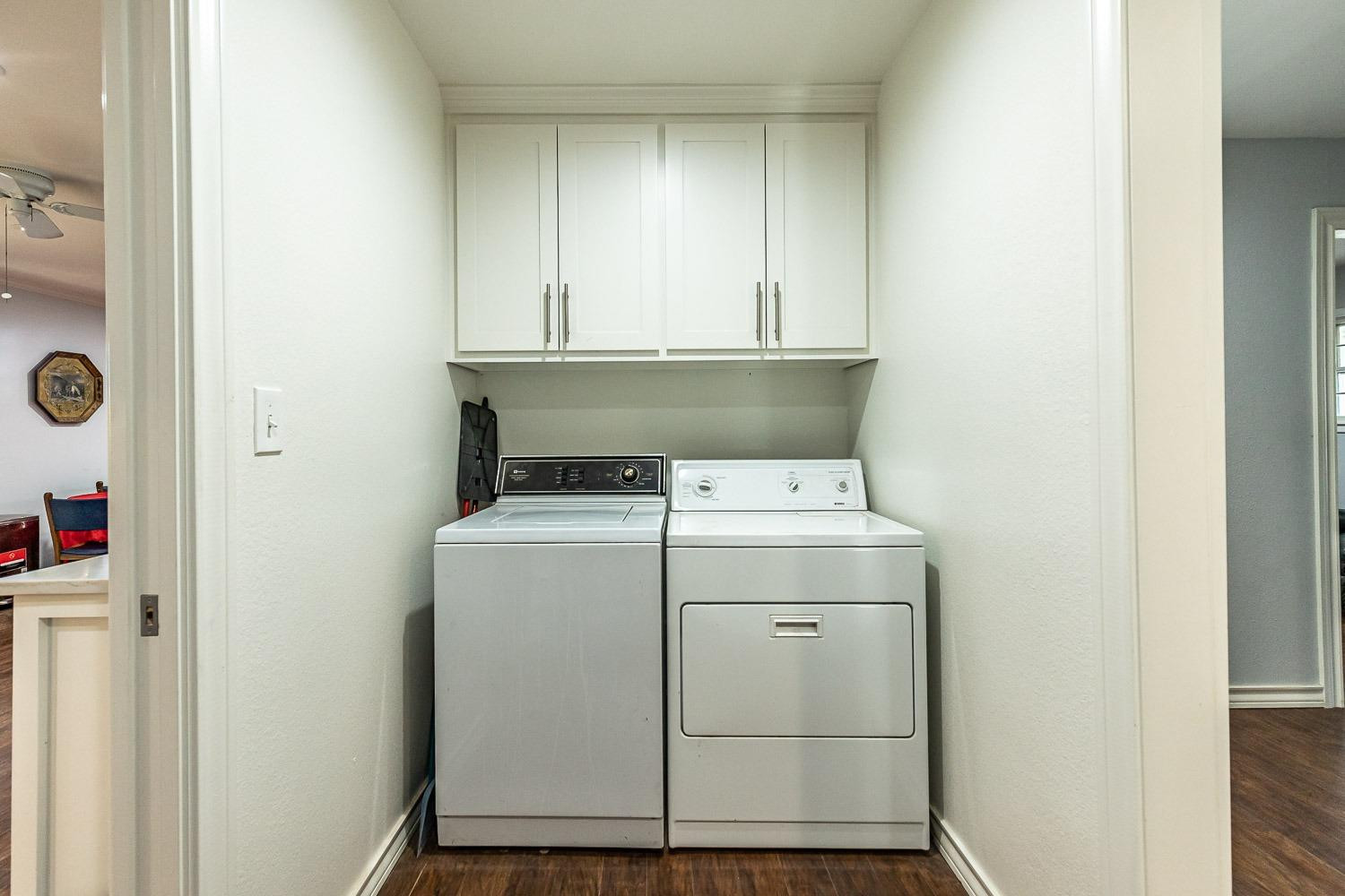 2327 60th Street Lubbock, TX 79412 - Photo 31 of 36 a utility room with dryer and washer