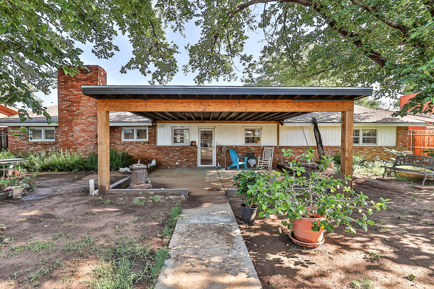 2327 60th Street Lubbock, TX 79412 - Photo 34 of 36 a view of a patio with chairs and plants