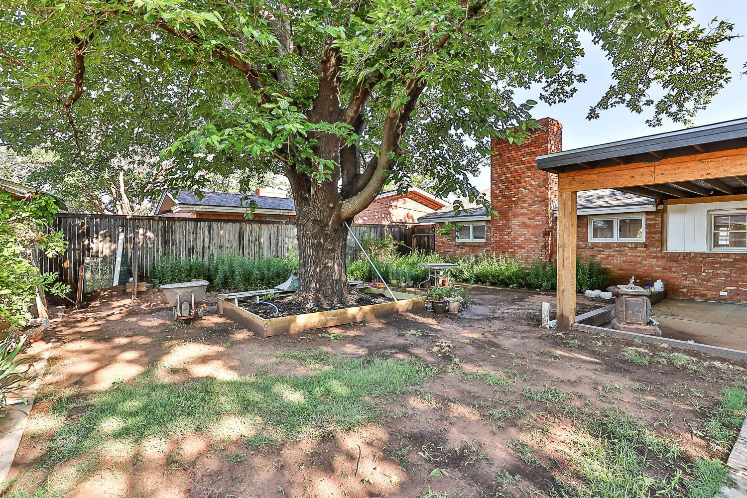 2327 60th Street Lubbock, TX 79412 - Photo 35 of 36 a view of a outdoor space with a tree