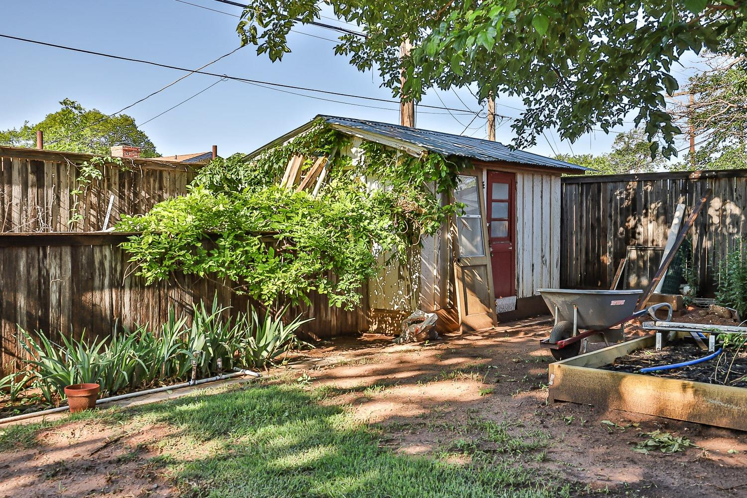 2327 60th Street Lubbock, TX 79412 - Photo 36 of 36 a view of a backyard with plants and a patio