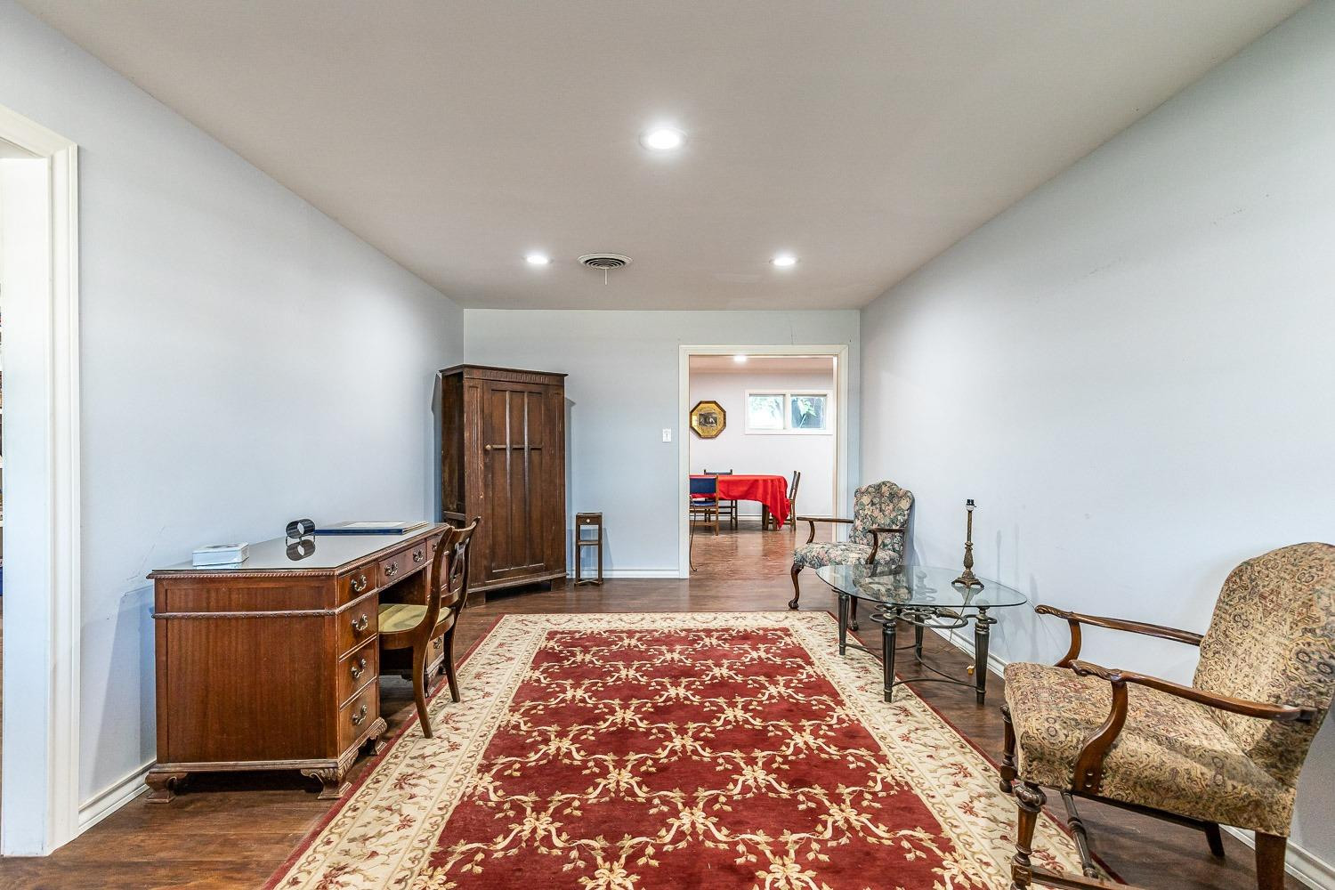 2327 60th Street Lubbock, TX 79412 - Photo 5 of 36 a room with furniture and a window