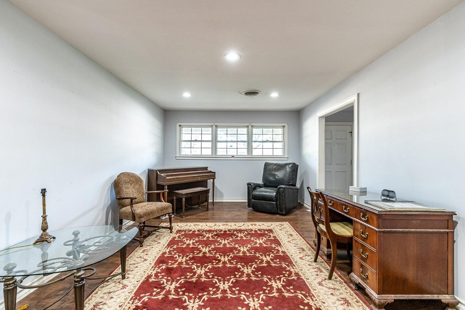 2327 60th Street Lubbock, TX 79412 - Photo 6 of 36 a living room with furniture rug and window